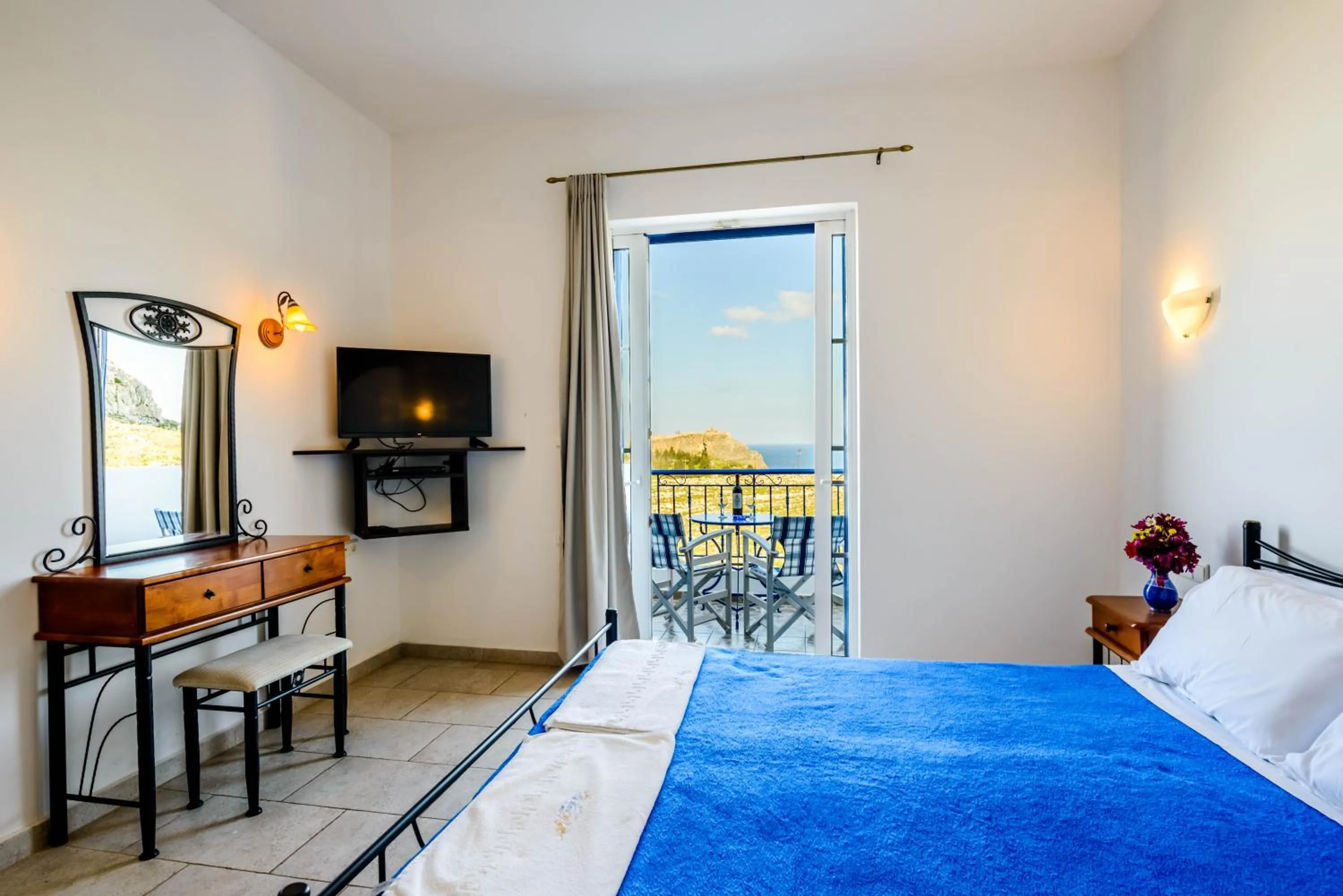 Bed in 'Lindian Myth' Sea View Studios