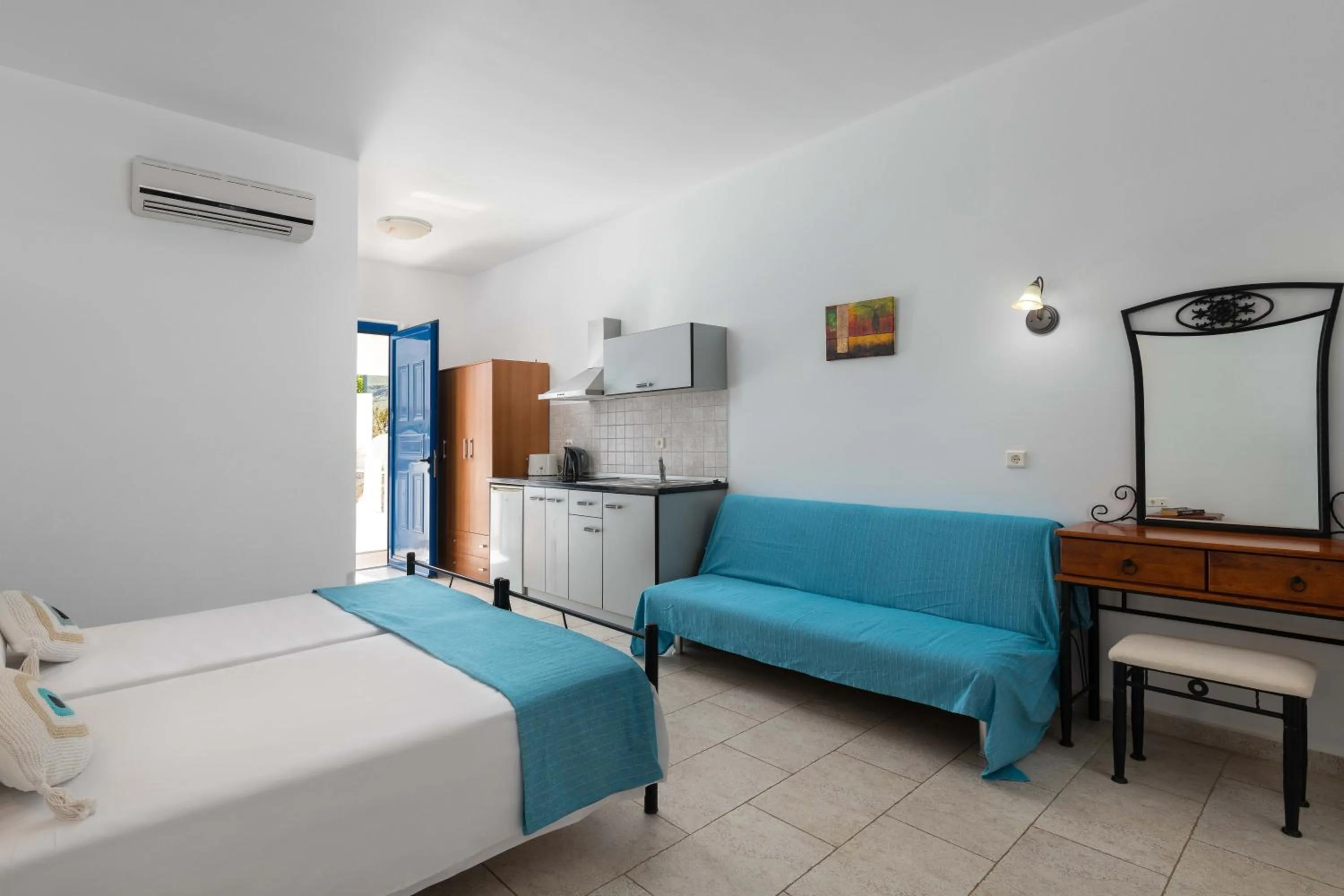 Bed in 'Lindian Myth' Sea View Studios