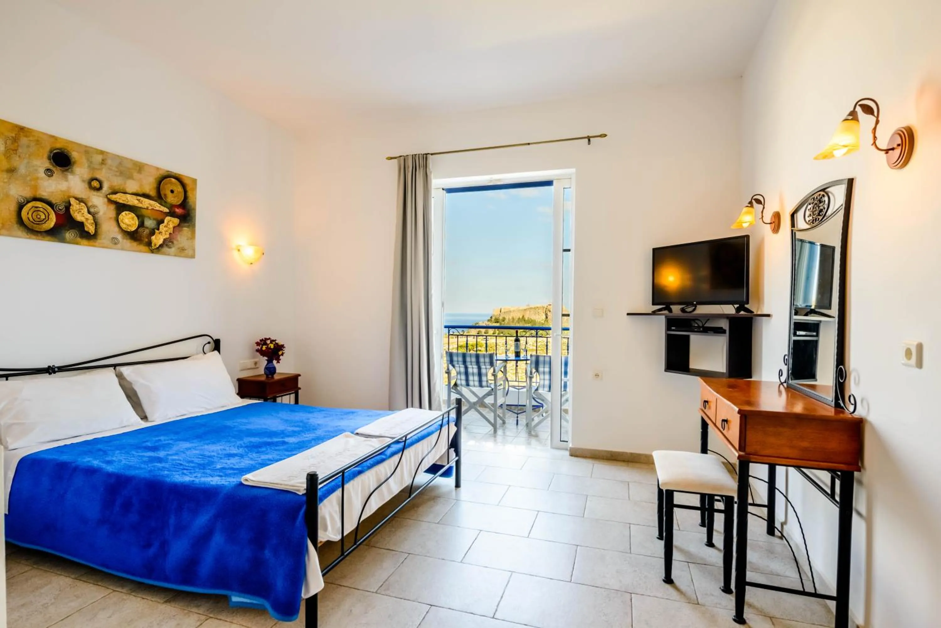 Bed in 'Lindian Myth' Sea View Studios