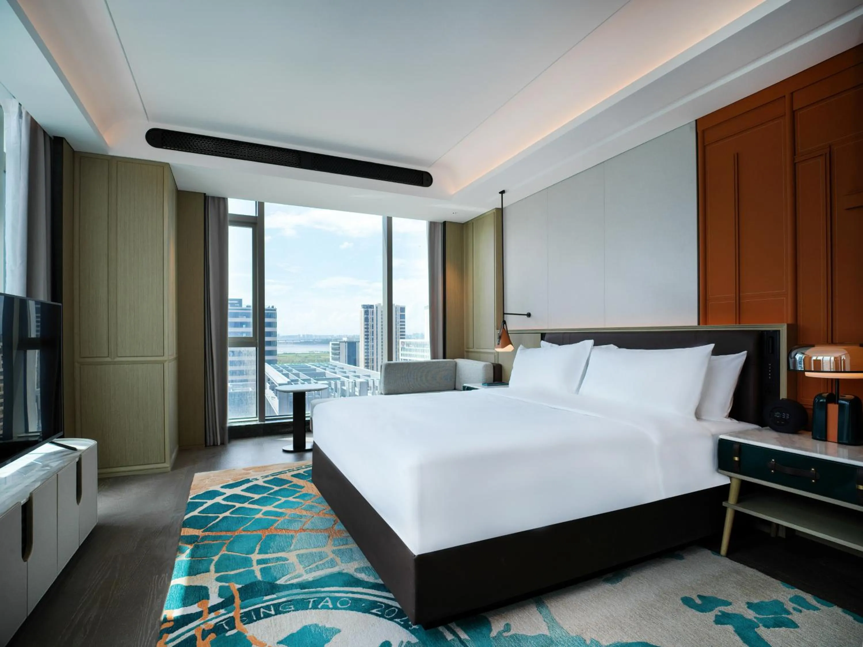 Bed in Renaissance Qingdao Hotel