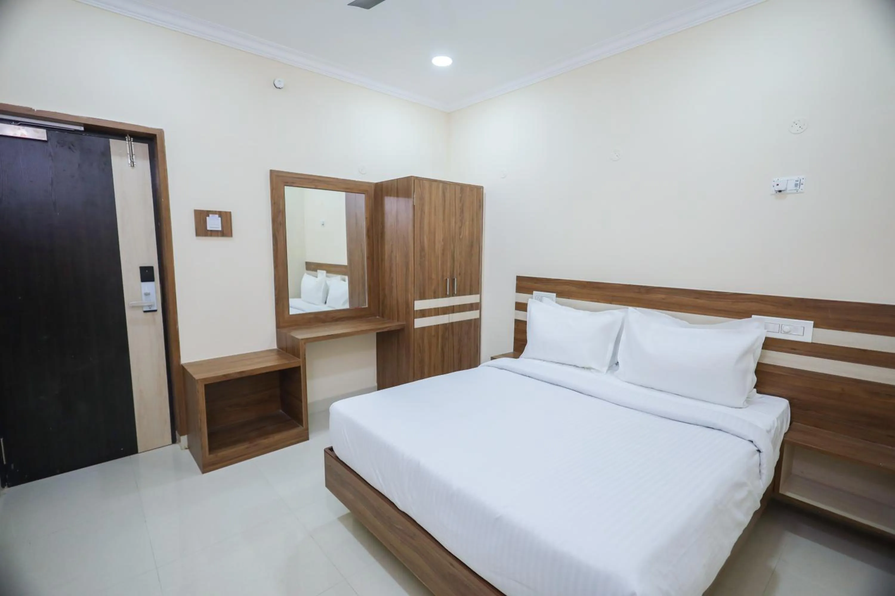 Bed in Vasantham Inn