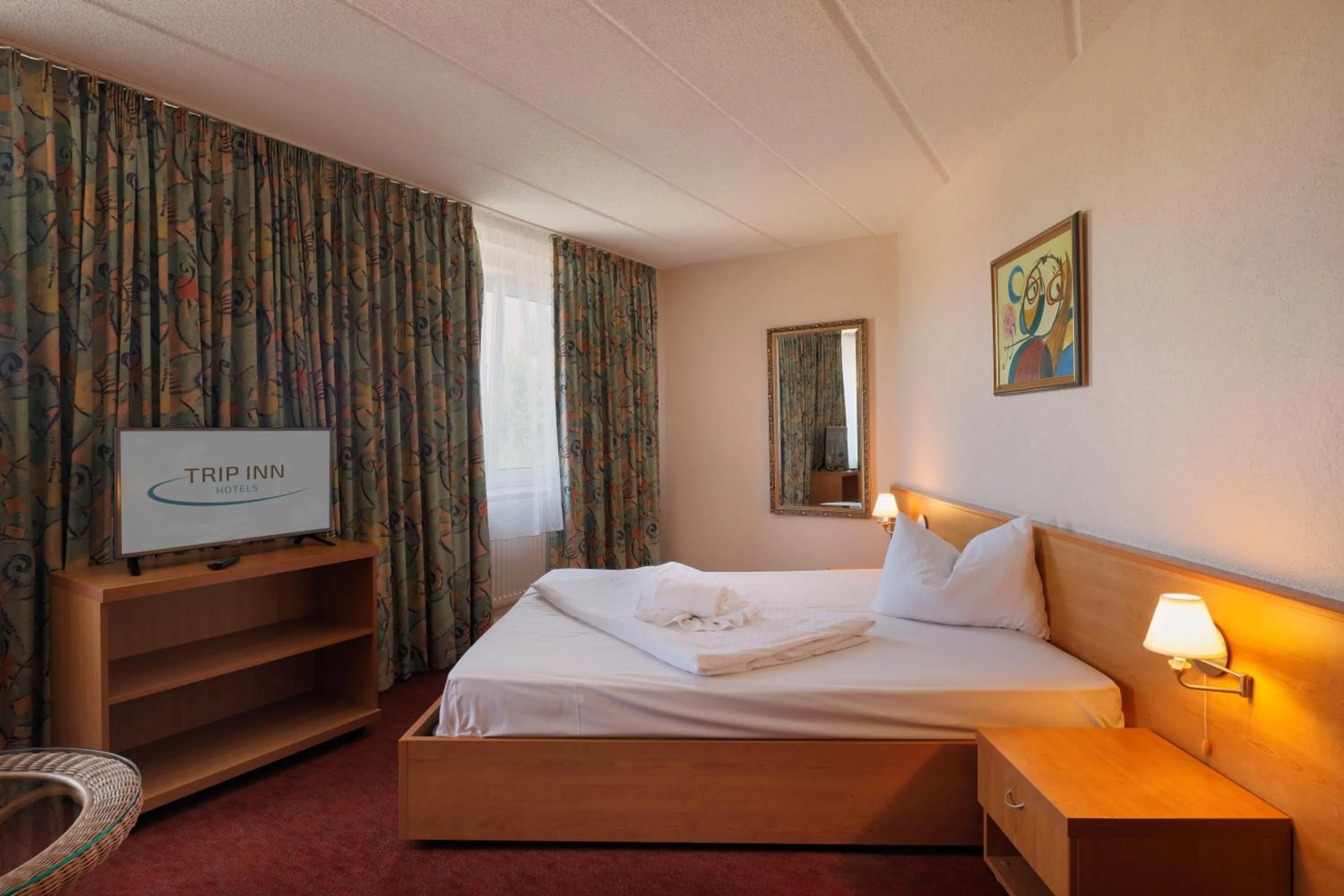 Bed in TRIP INN Axxon Hotel