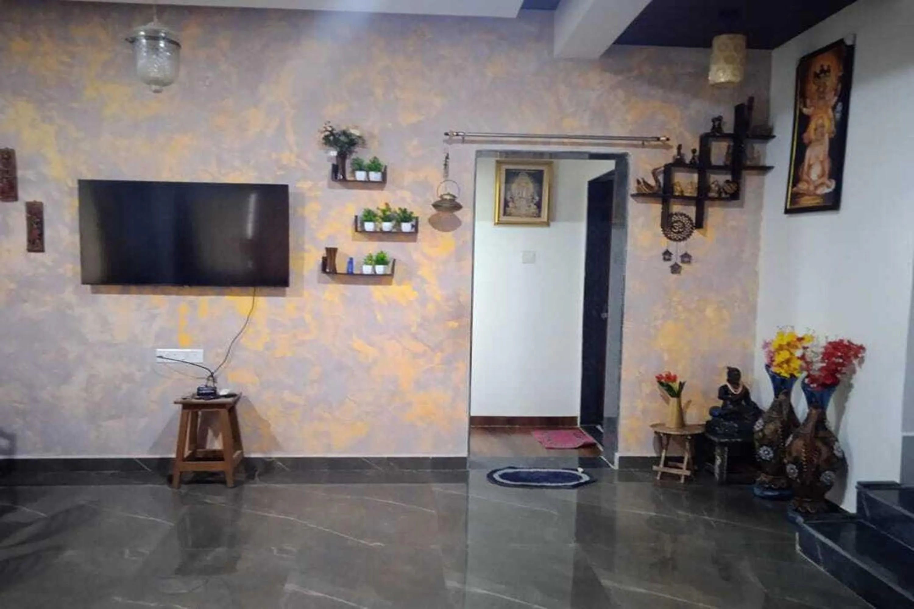 Communal lounge/ TV room in Vighnaharta Villa