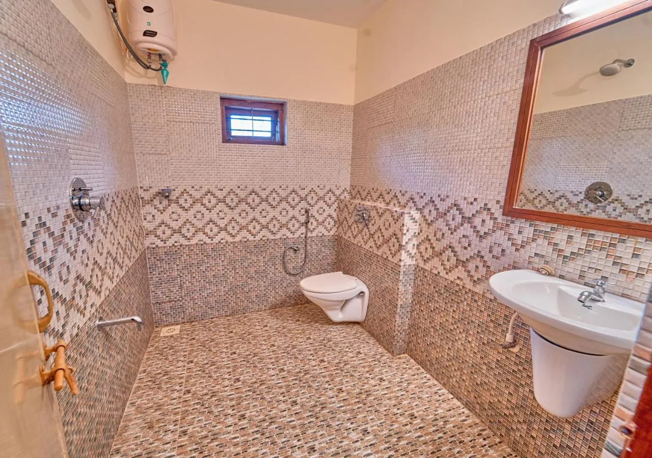 Shower in Ushasree Wayanad Premium Pool Resort by VOYE HOMES