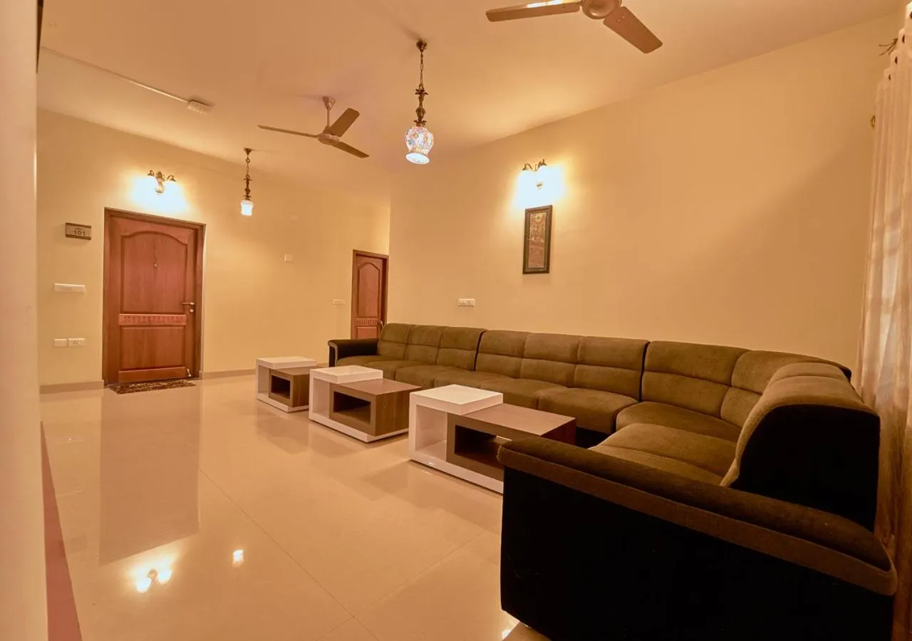 Living room in Ushasree Wayanad Premium Pool Resort by VOYE HOMES