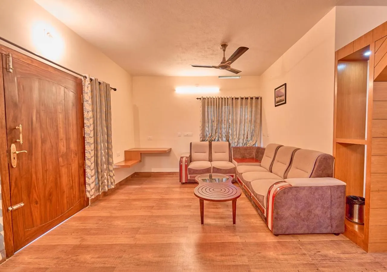 Living room in Ushasree Wayanad Premium Pool Resort by VOYE HOMES