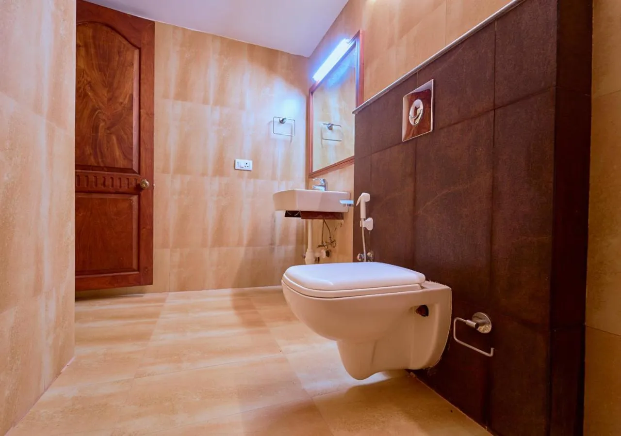 Toilet in Ushasree Wayanad Premium Pool Resort by VOYE HOMES