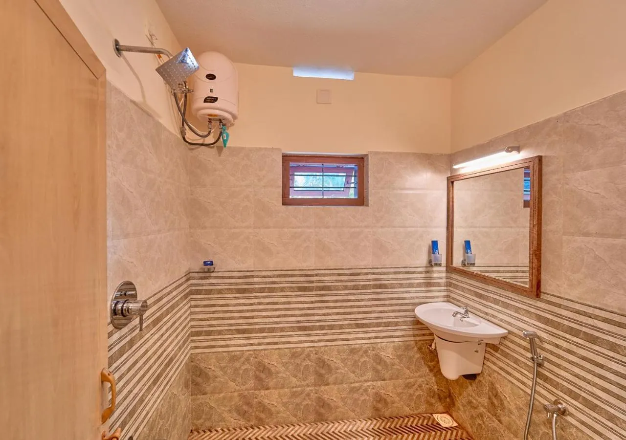 Shower in Ushasree Wayanad Premium Pool Resort by VOYE HOMES