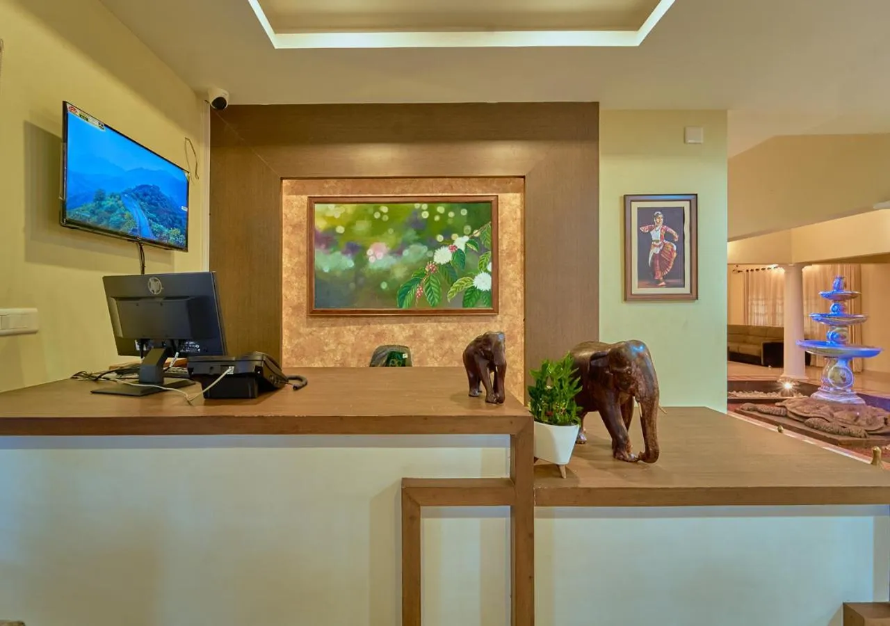 TV and multimedia in Ushasree Wayanad Premium Pool Resort by VOYE HOMES