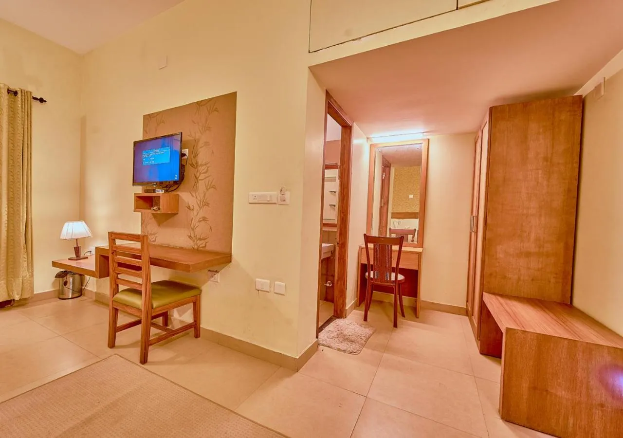 TV and multimedia in Ushasree Wayanad Premium Pool Resort by VOYE HOMES