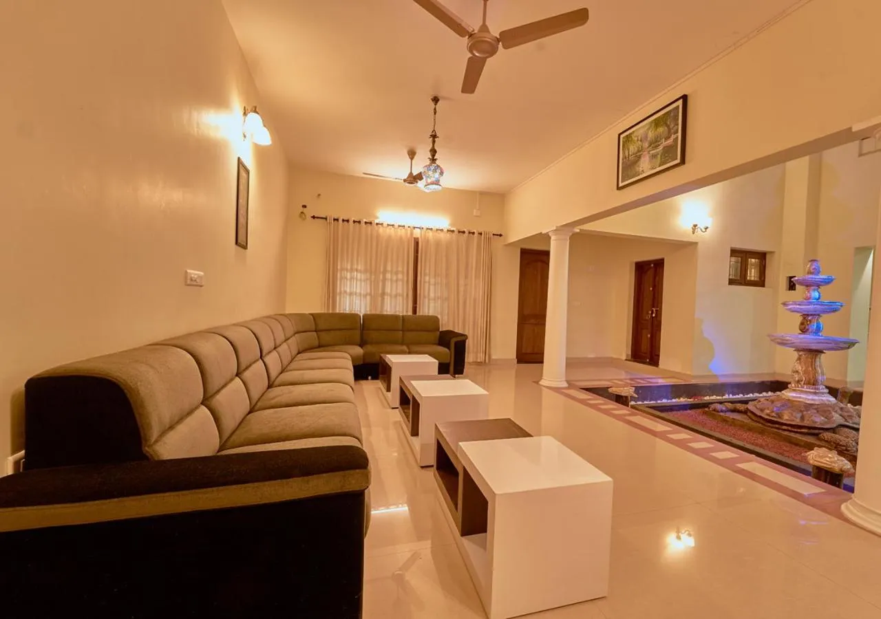 Living room in Ushasree Wayanad Premium Pool Resort by VOYE HOMES