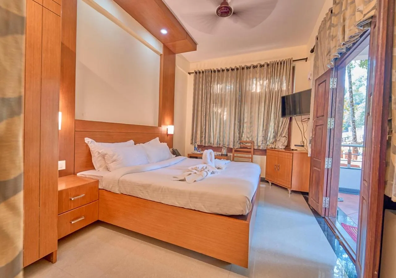 Bed in Ushasree Wayanad Premium Pool Resort by VOYE HOMES