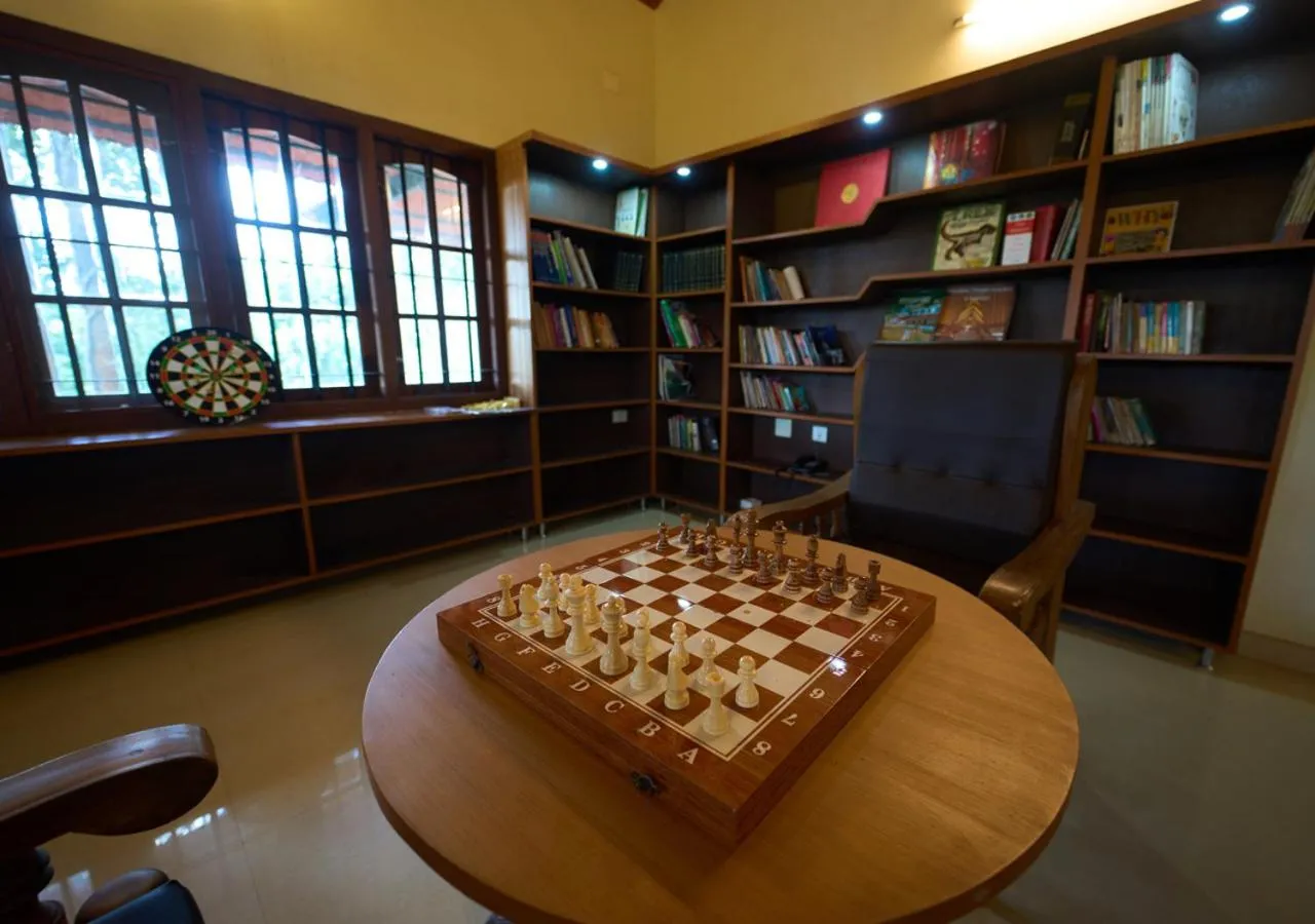 Library in Ushasree Wayanad Premium Pool Resort by VOYE HOMES