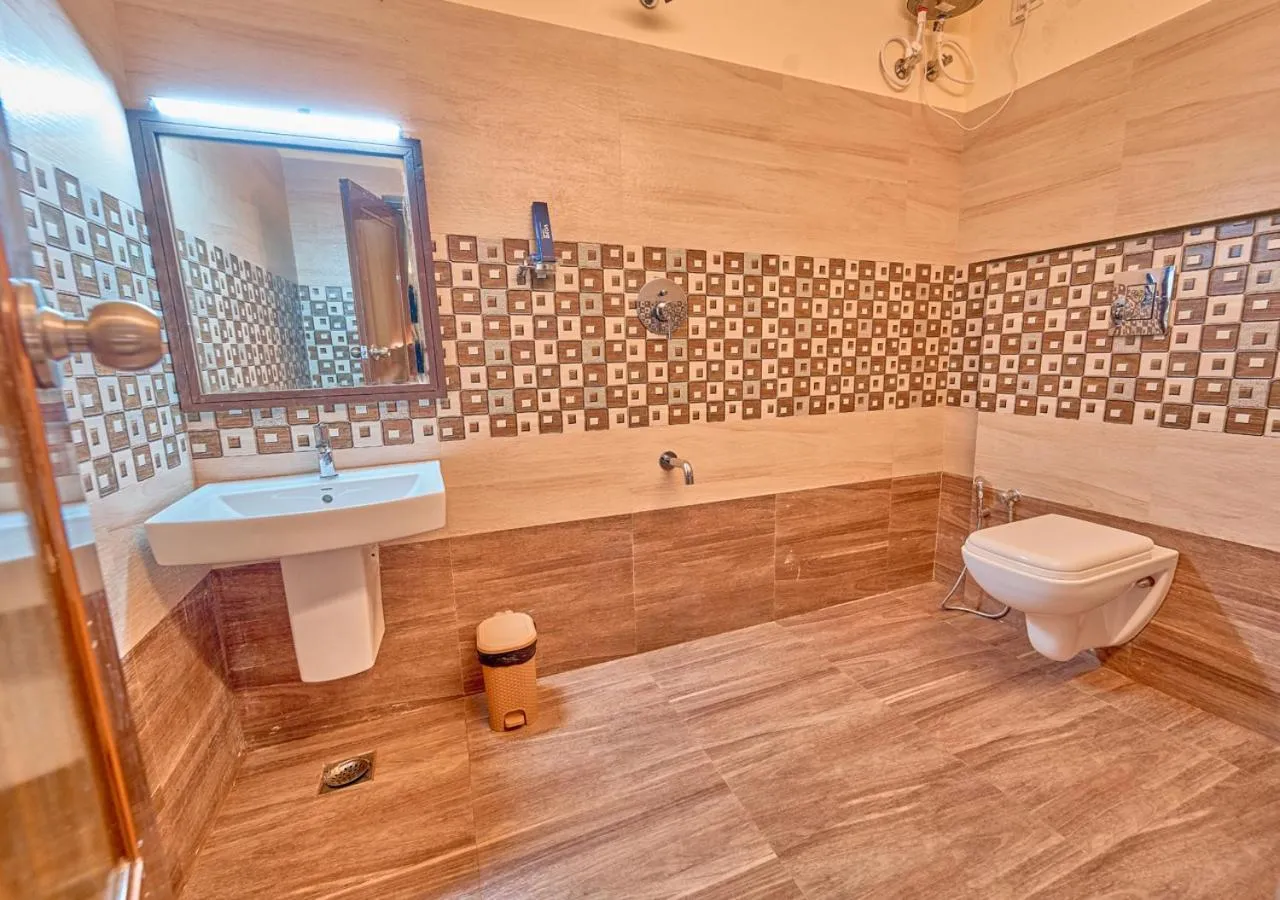 Shower in Ushasree Wayanad Premium Pool Resort by VOYE HOMES