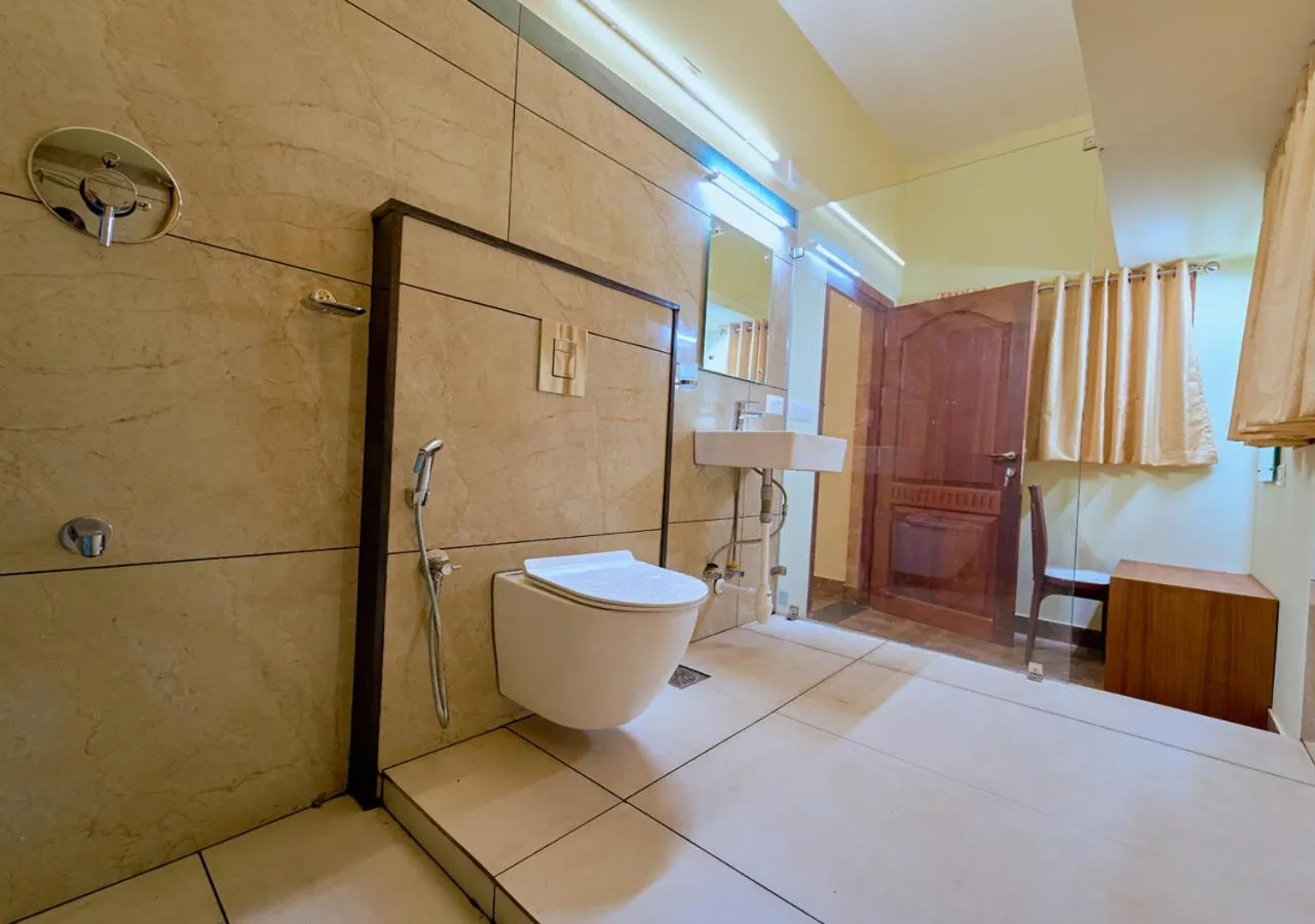 Shower in Ushasree Wayanad Premium Pool Resort by VOYE HOMES