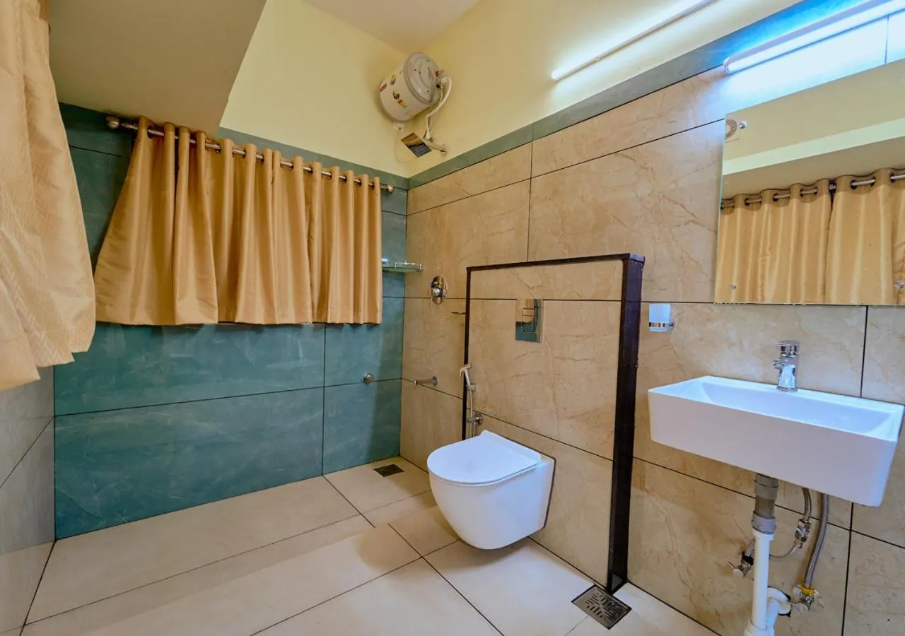Toilet in Ushasree Wayanad Premium Pool Resort by VOYE HOMES