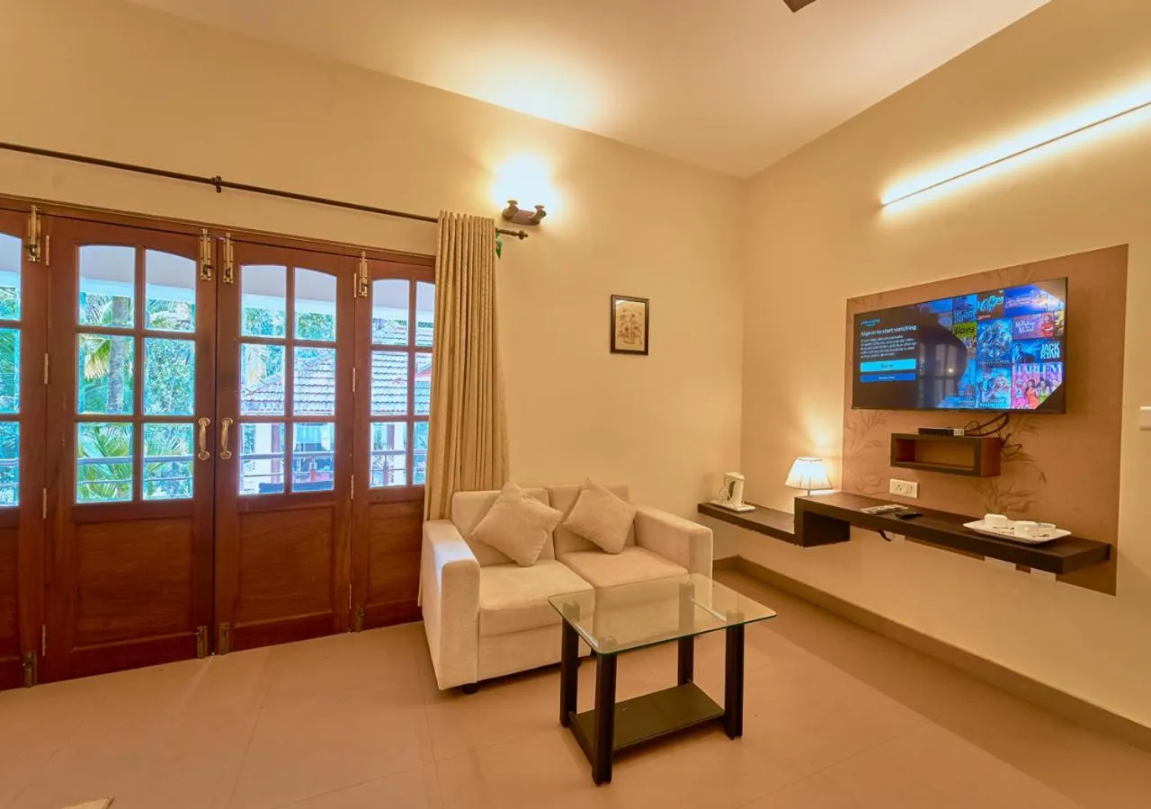 TV and multimedia in Ushasree Wayanad Premium Pool Resort by VOYE HOMES
