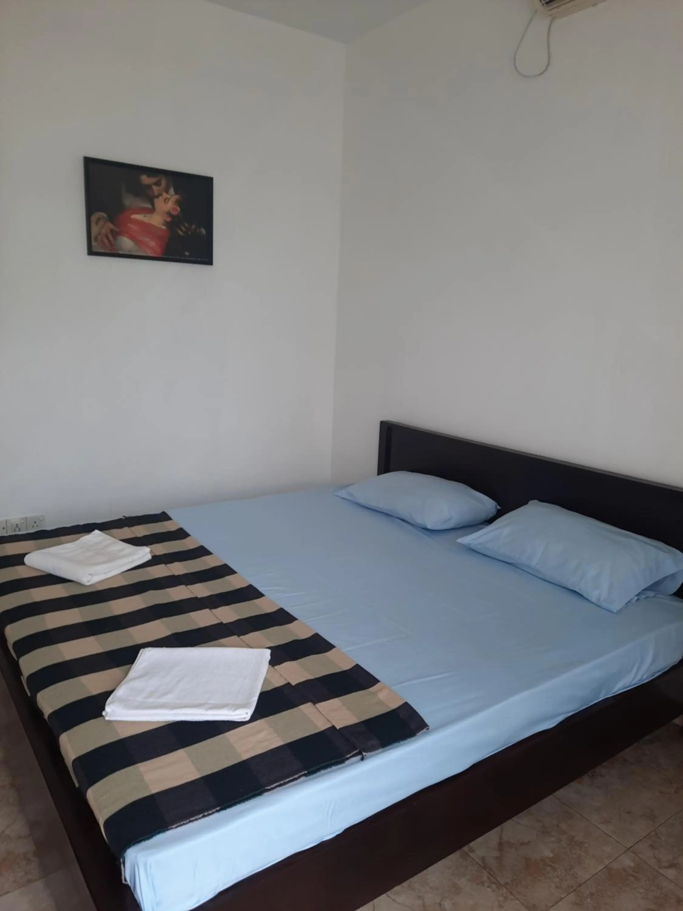 Bed in White Surfing Beach Resort