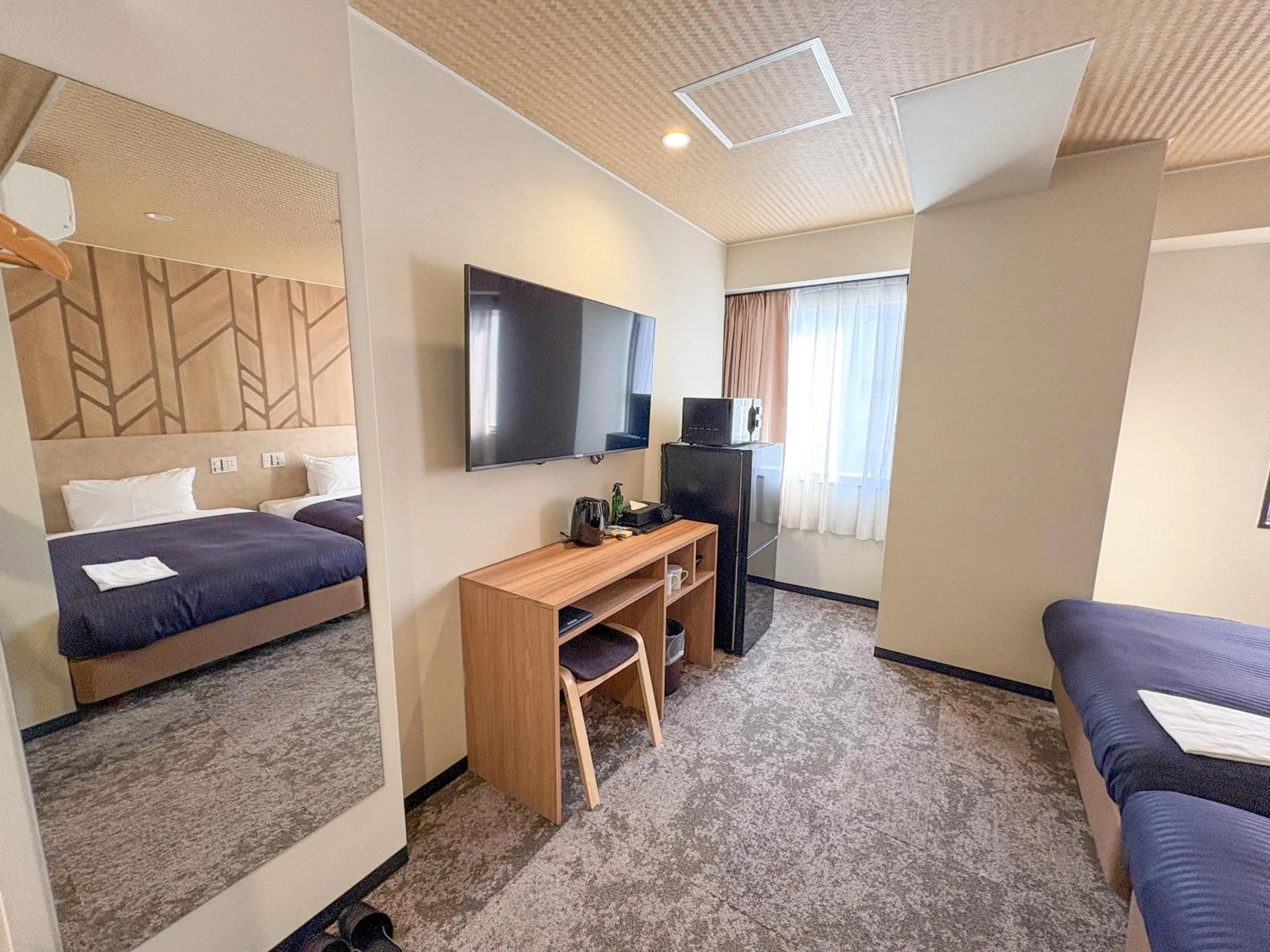Bed in Hotel Livemax Budget Kagoshima Tenmonkan