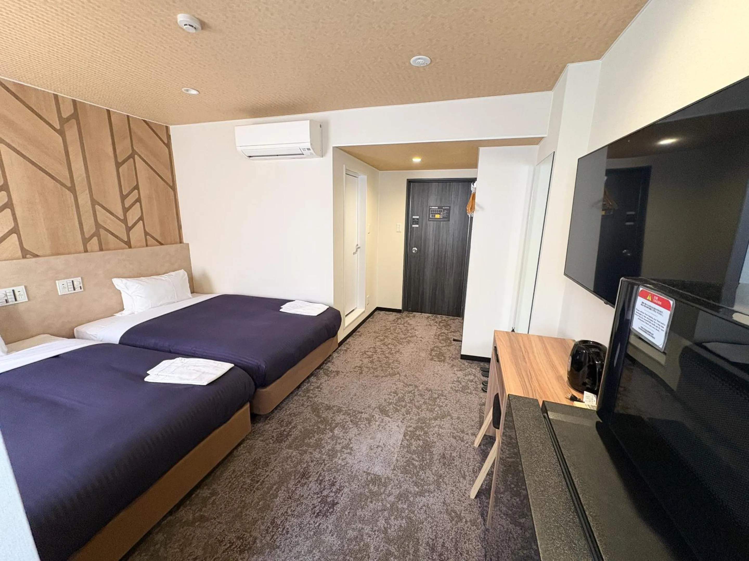 Bed in Hotel Livemax Budget Kagoshima Tenmonkan