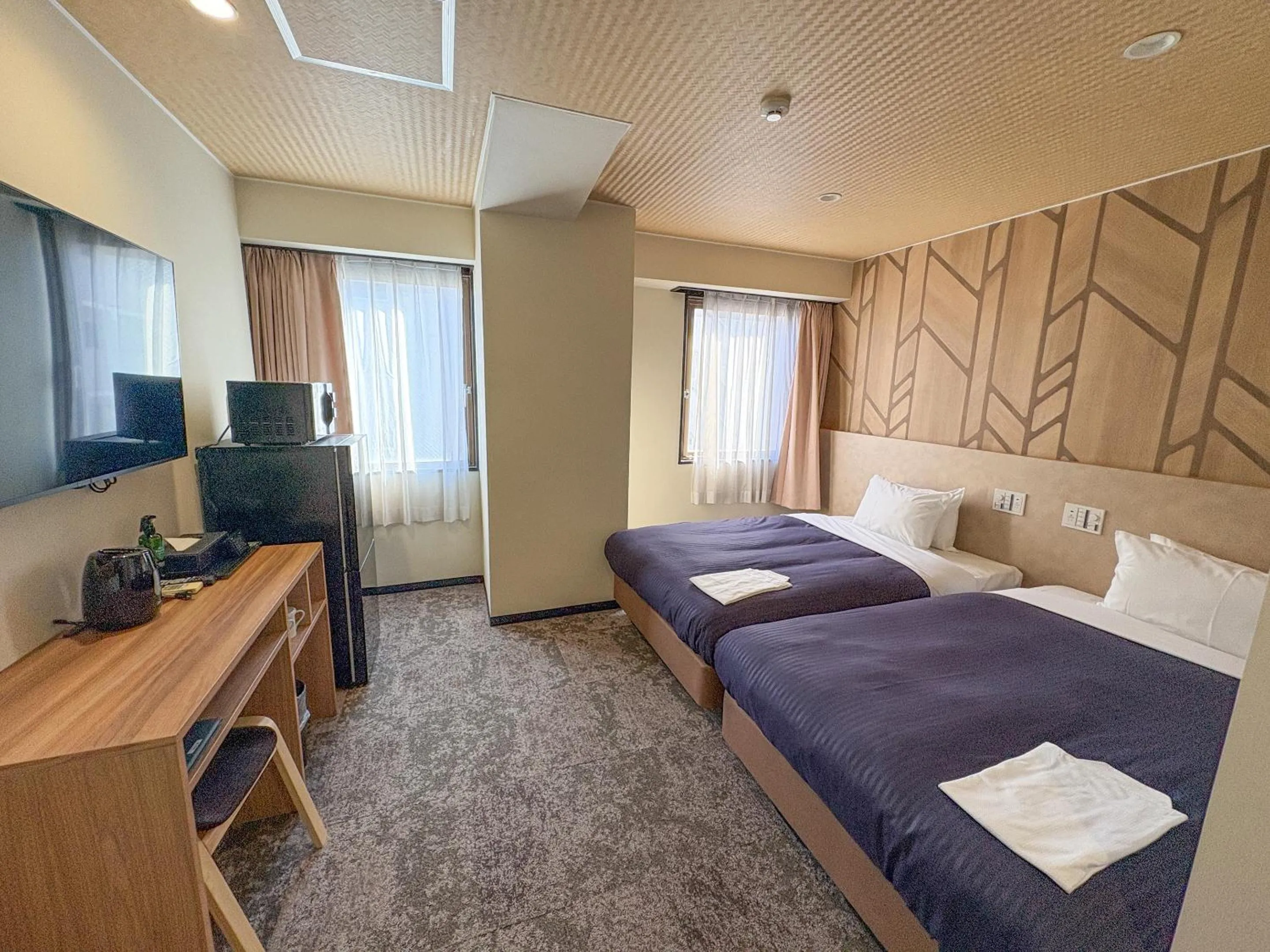 Bed in Hotel Livemax Budget Kagoshima Tenmonkan