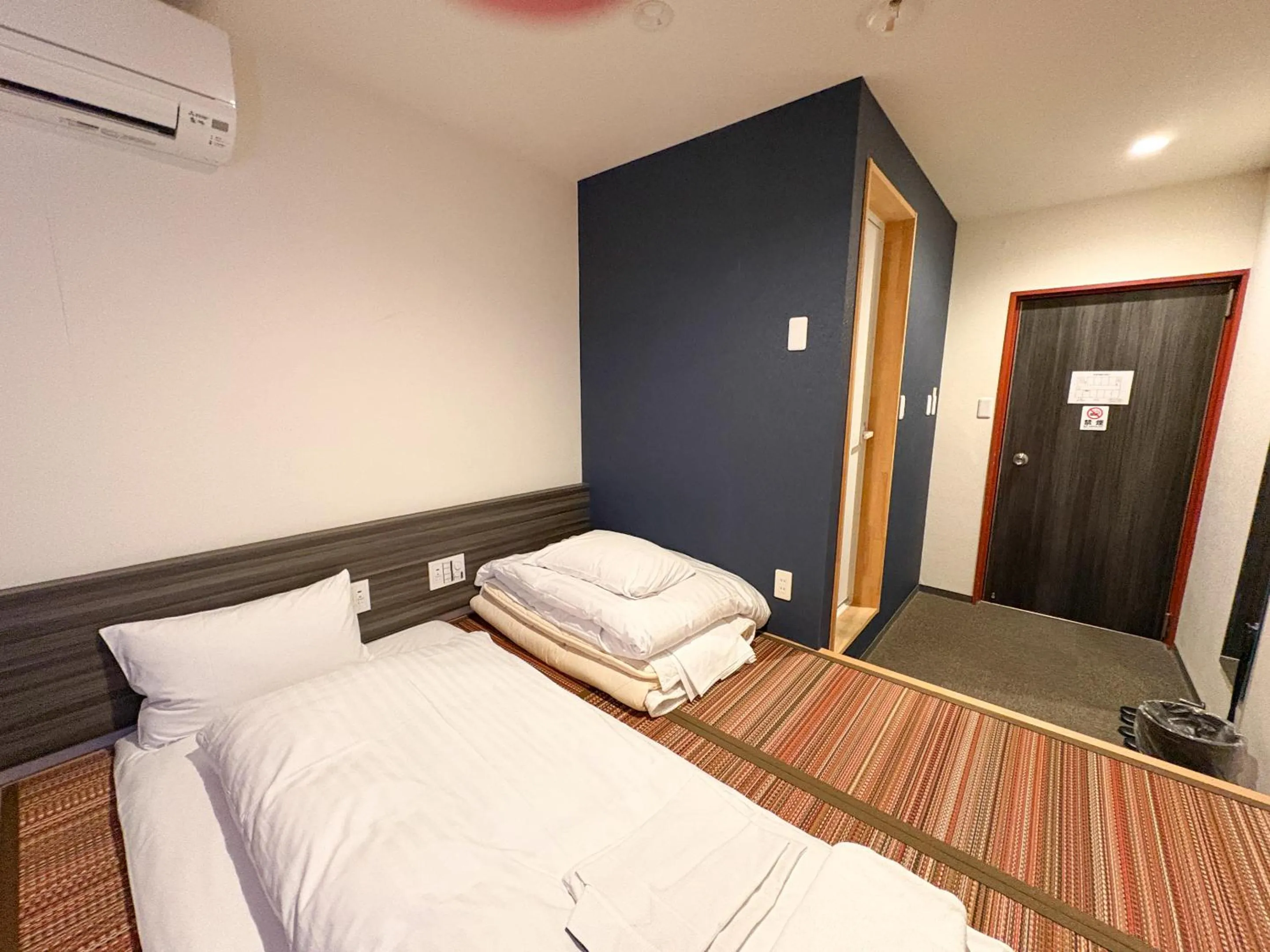 Bed in Hotel Livemax Budget Kagoshima Tenmonkan