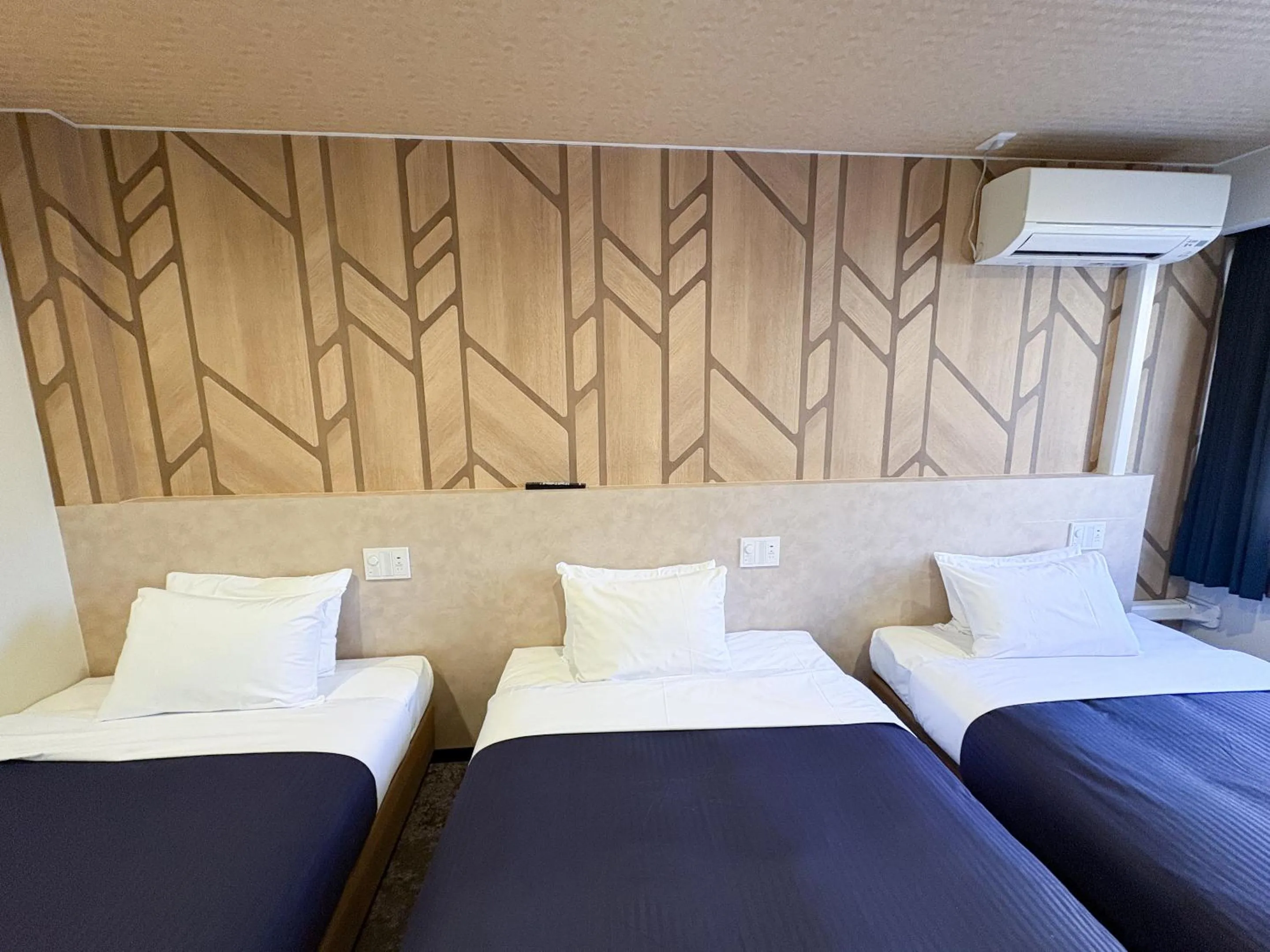 Bed in Hotel Livemax Budget Kagoshima Tenmonkan