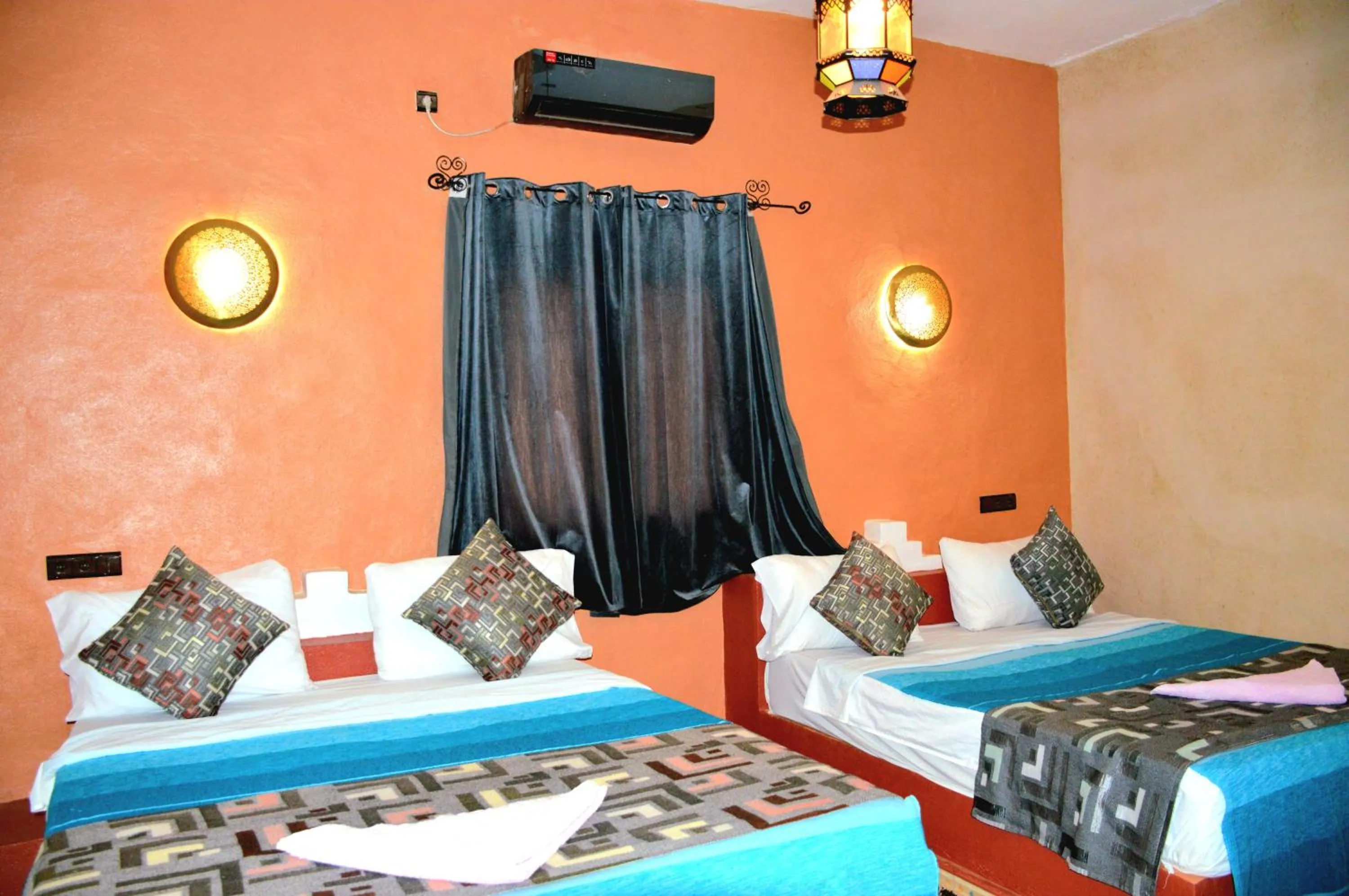 Bed in Kasbah Du Berger & Piscine