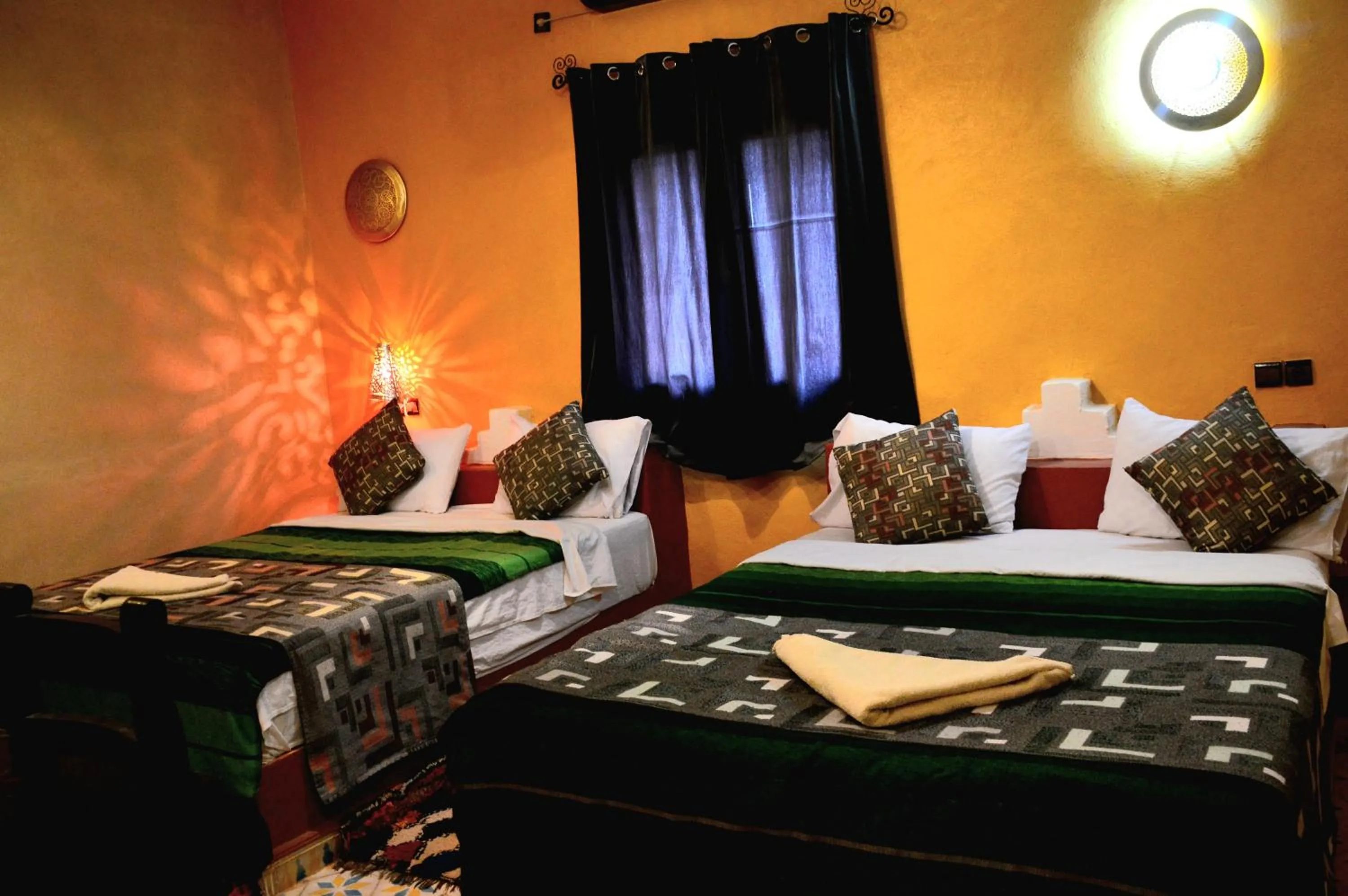 Bed in Kasbah Du Berger & Piscine