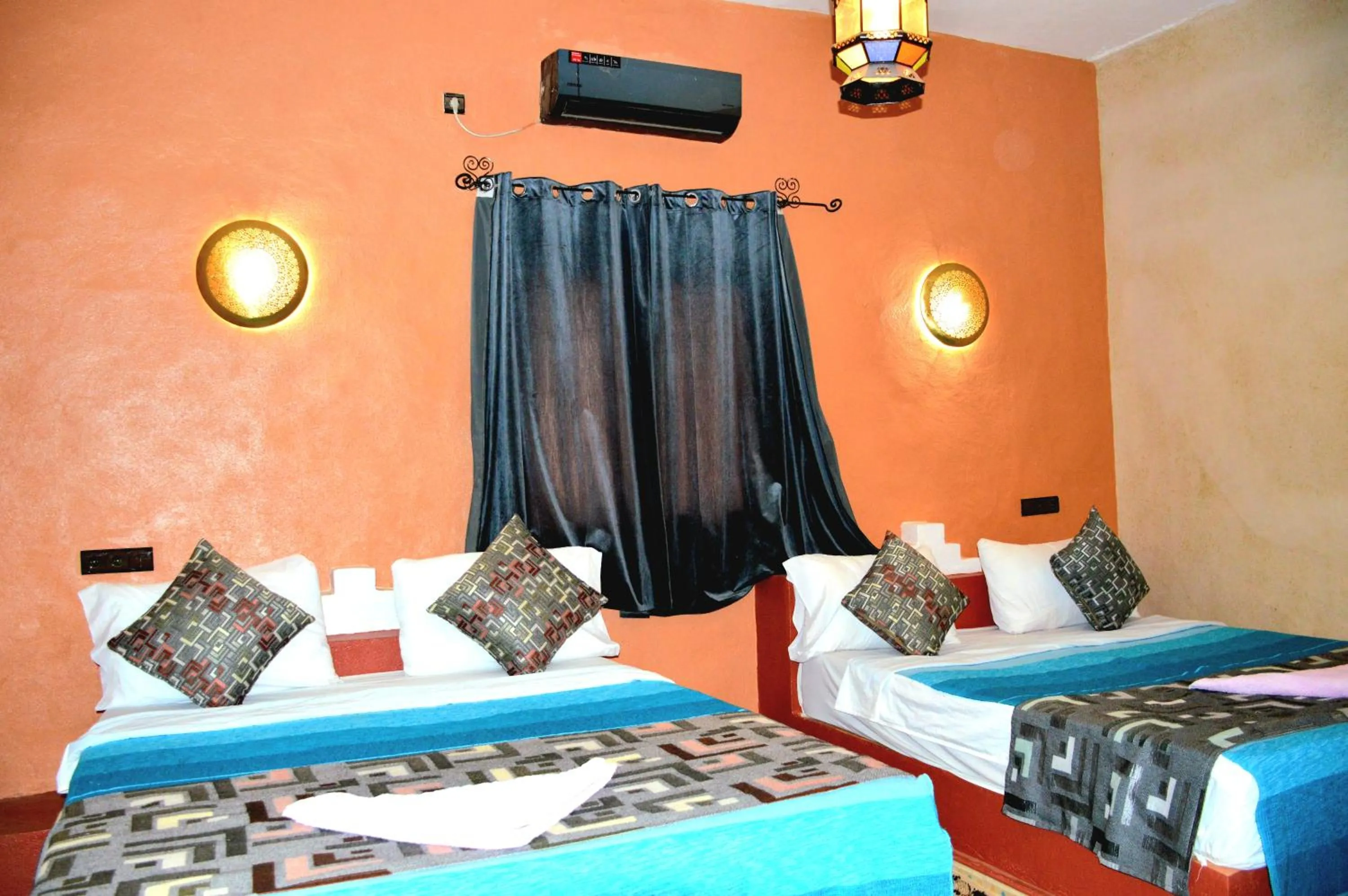 Bed in Kasbah Du Berger & Piscine