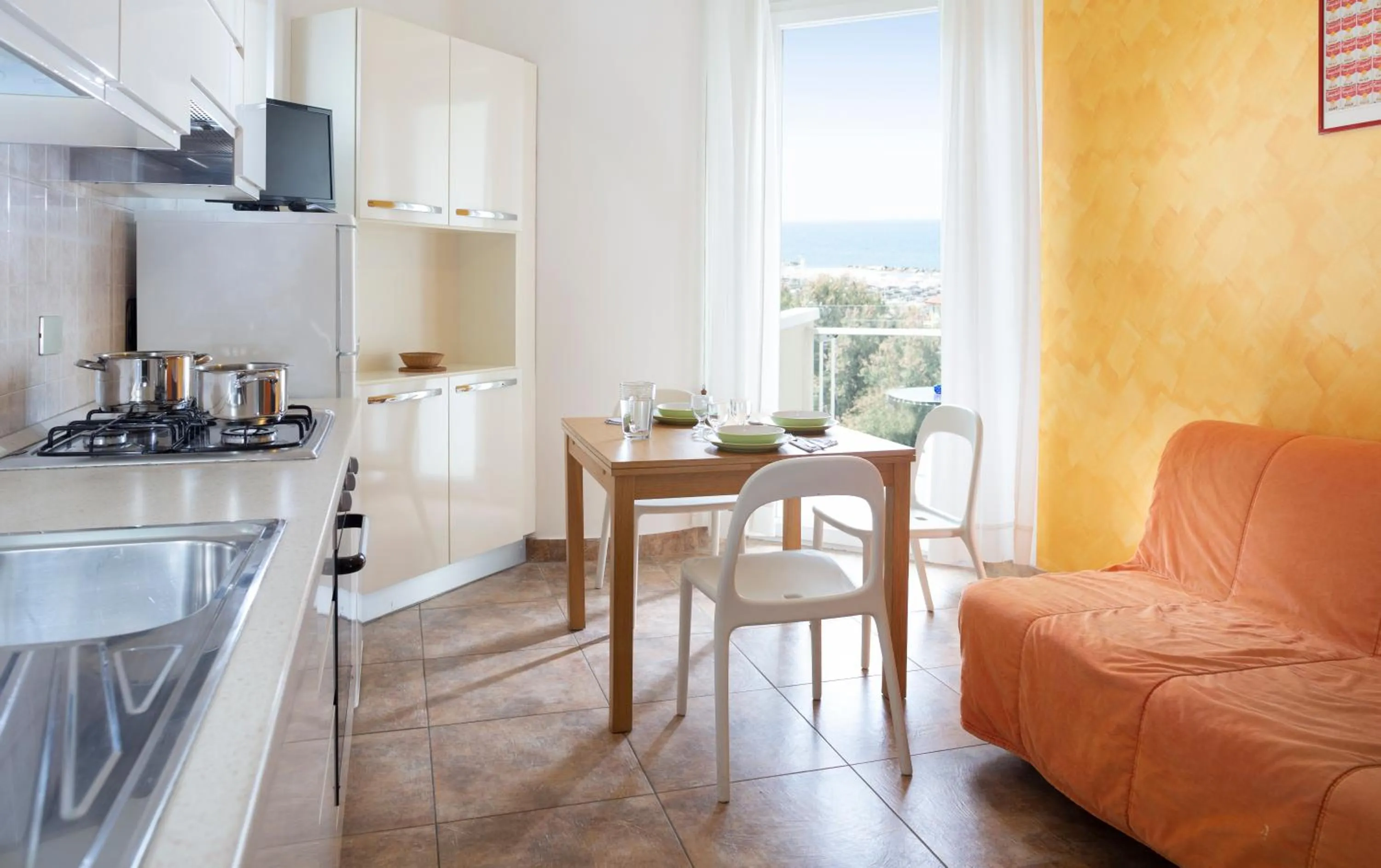 Kitchen or kitchenette in SoleMare Hotel e Residence