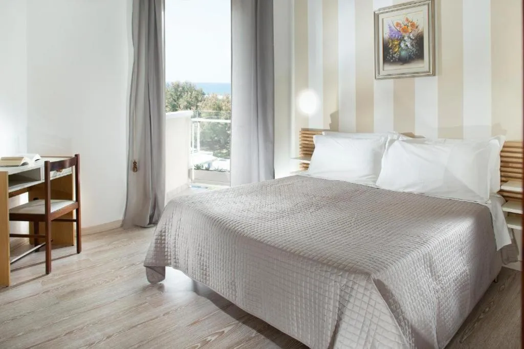 Bed in SoleMare Hotel e Residence