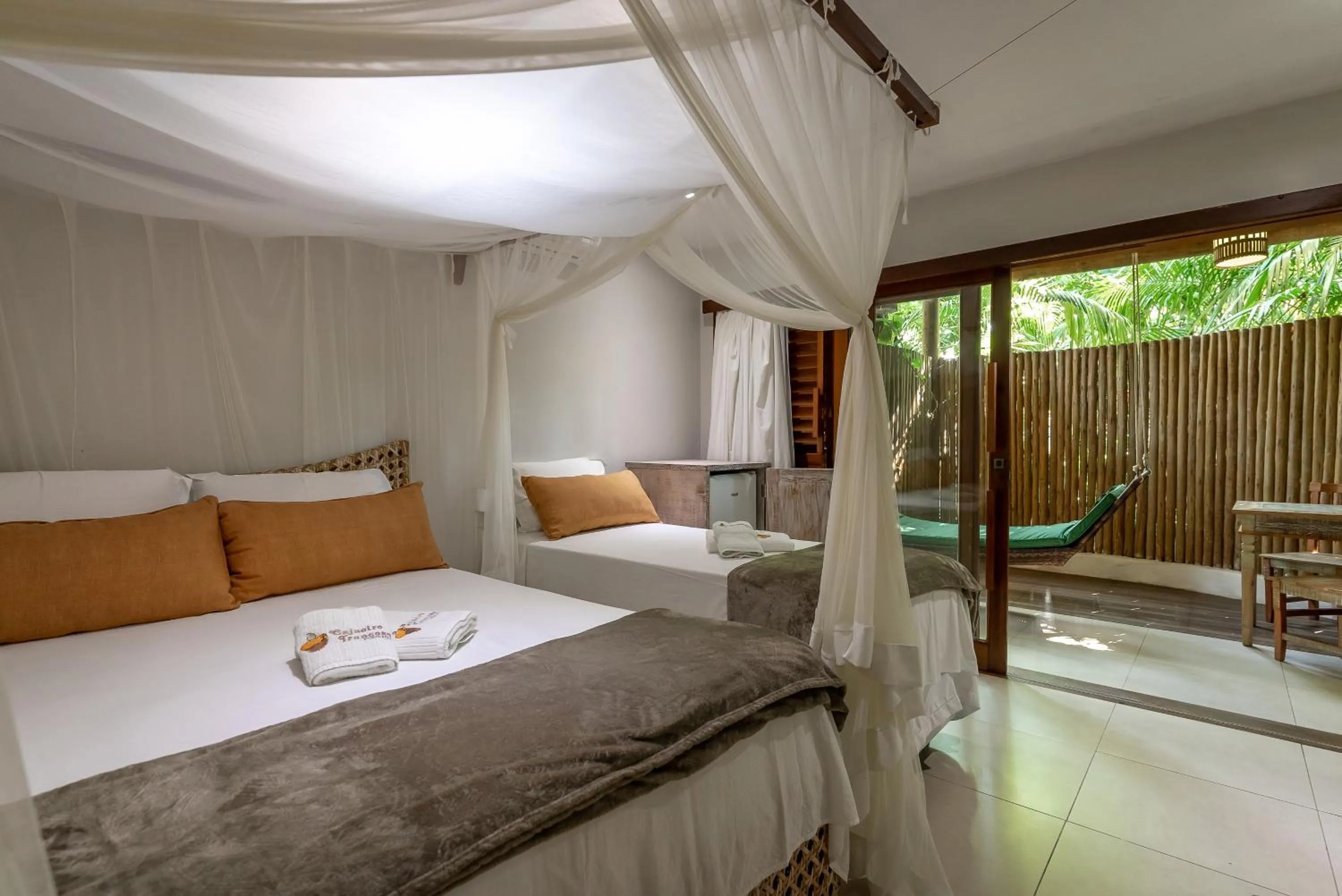 Bed in Pousada Cajueiro Trancoso