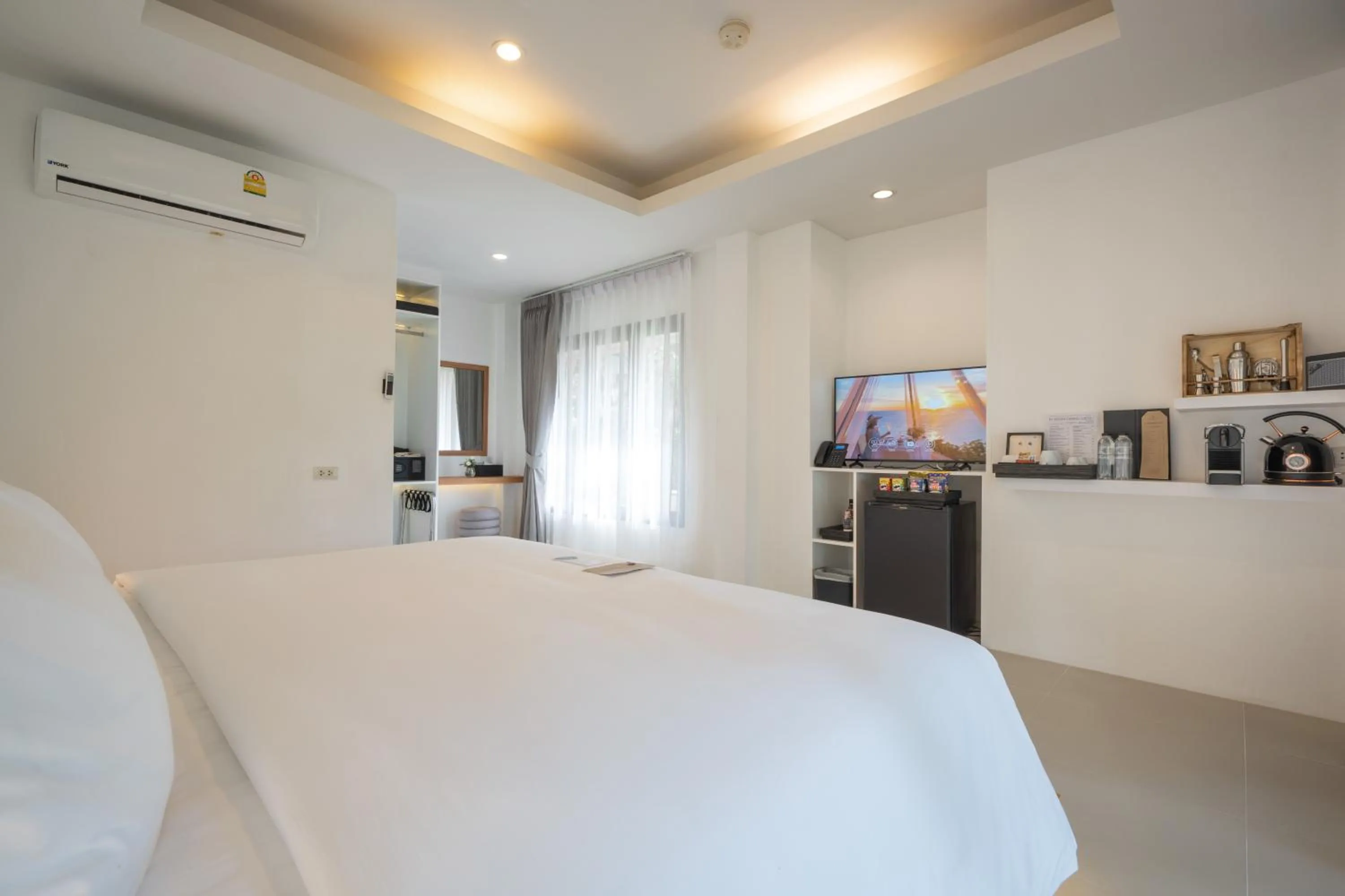 Bed in ANONA SUNSET Boutique