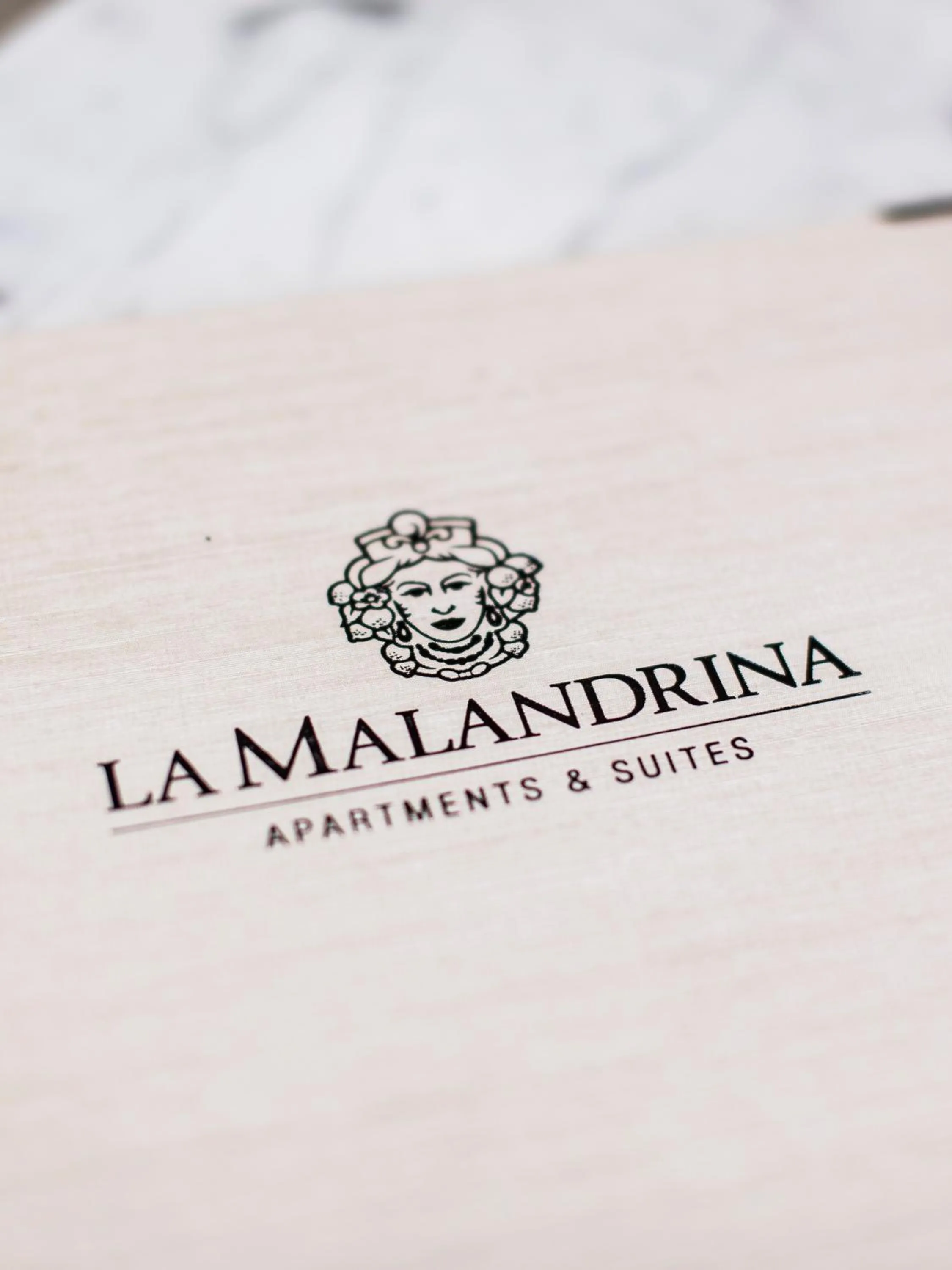 Property logo or sign in La Malandrina - Apartments & Suites
