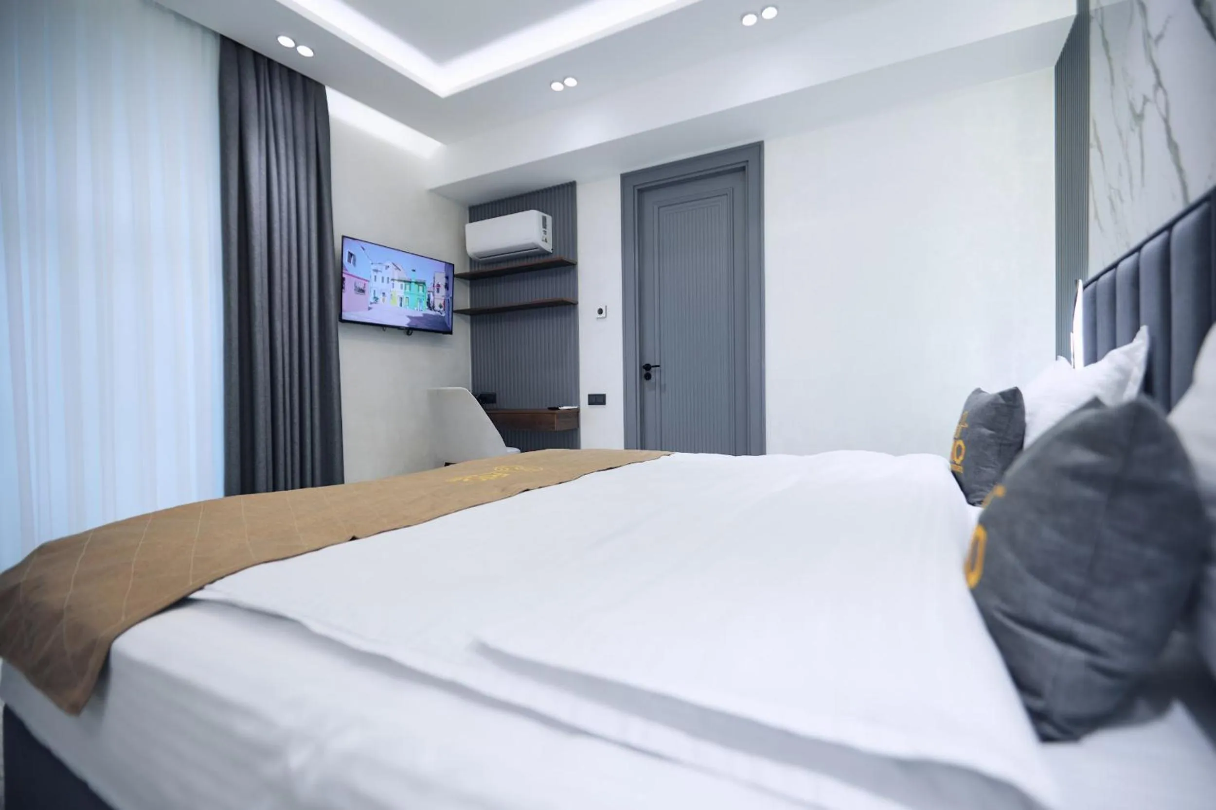 Communal lounge/ TV room, Bed in RIO Hotel