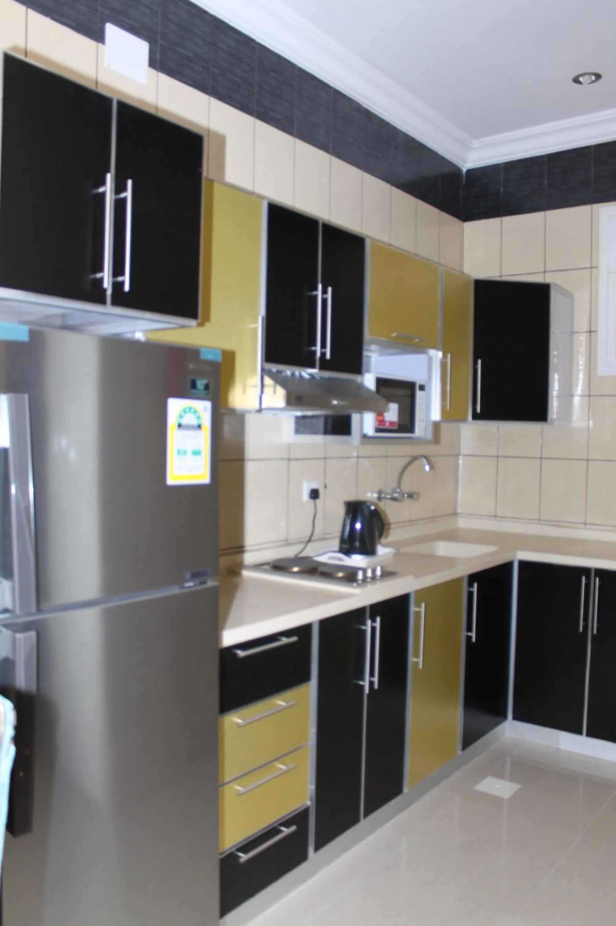 Kitchen or kitchenette in فخامة الديار للشقق المخدومة Fakhamat Aldyar For Serviced Apartments