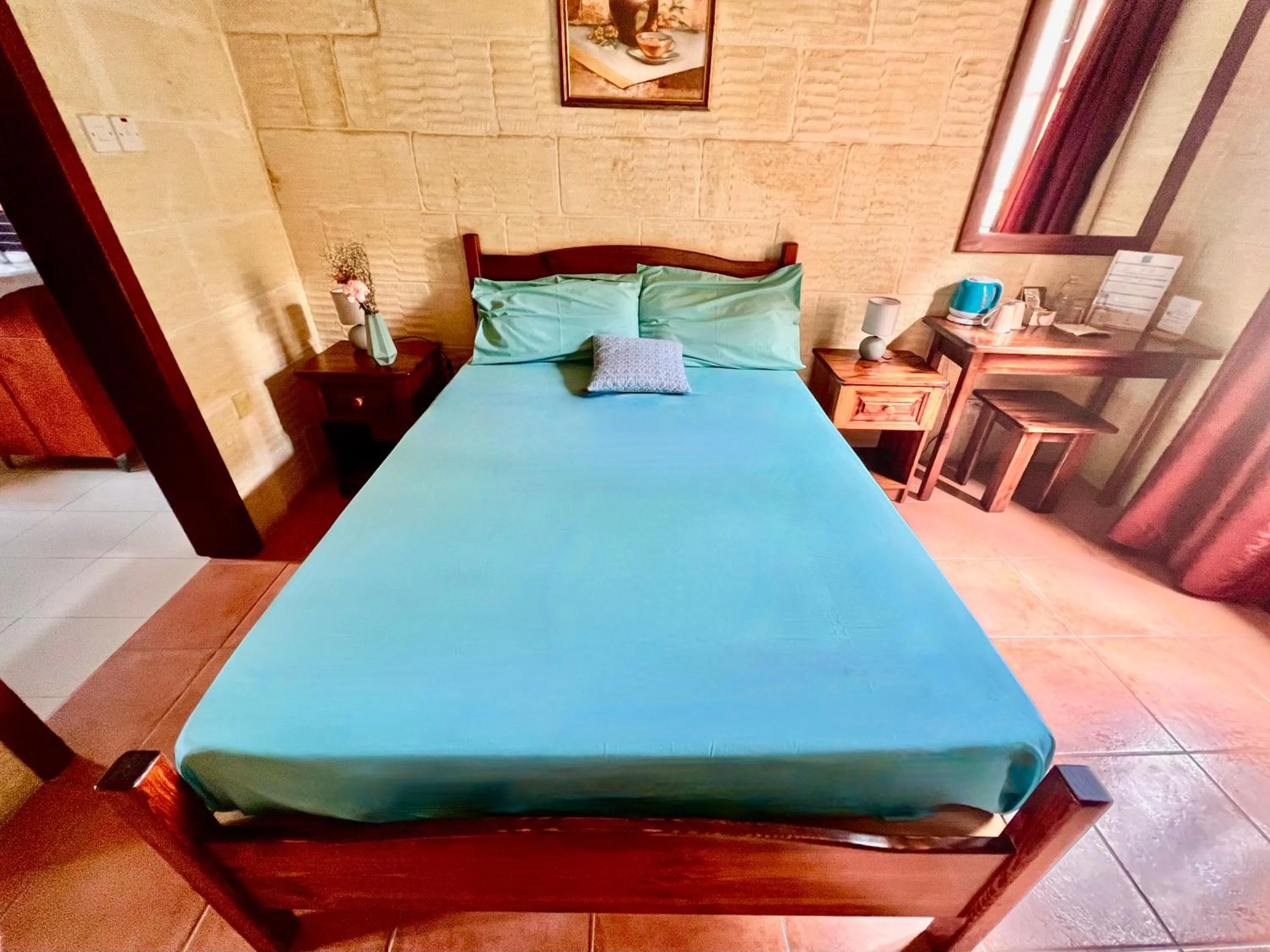 Bed in Grotto's Paradise B&B