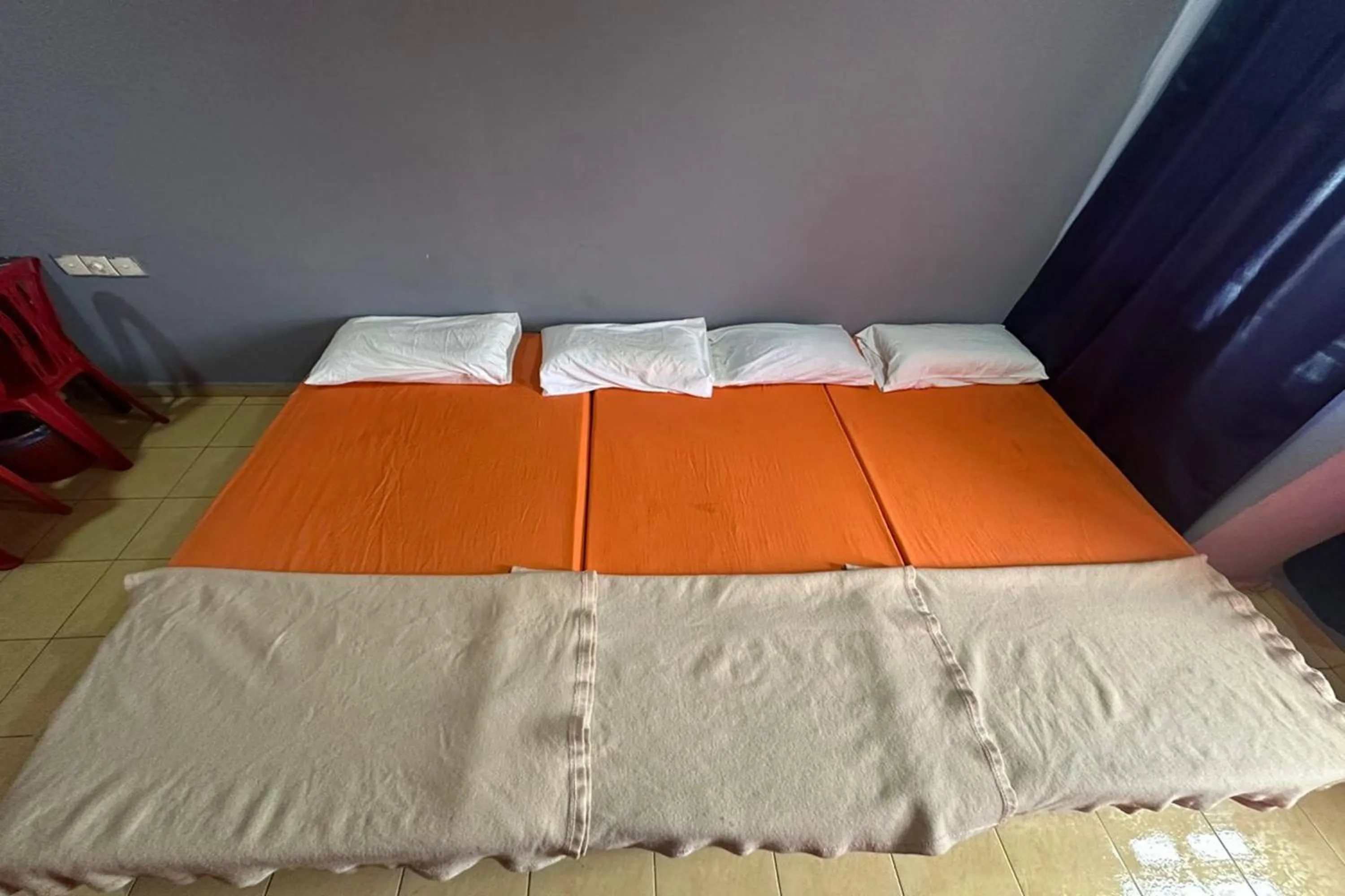 Bed in I Rose Budget Hotel