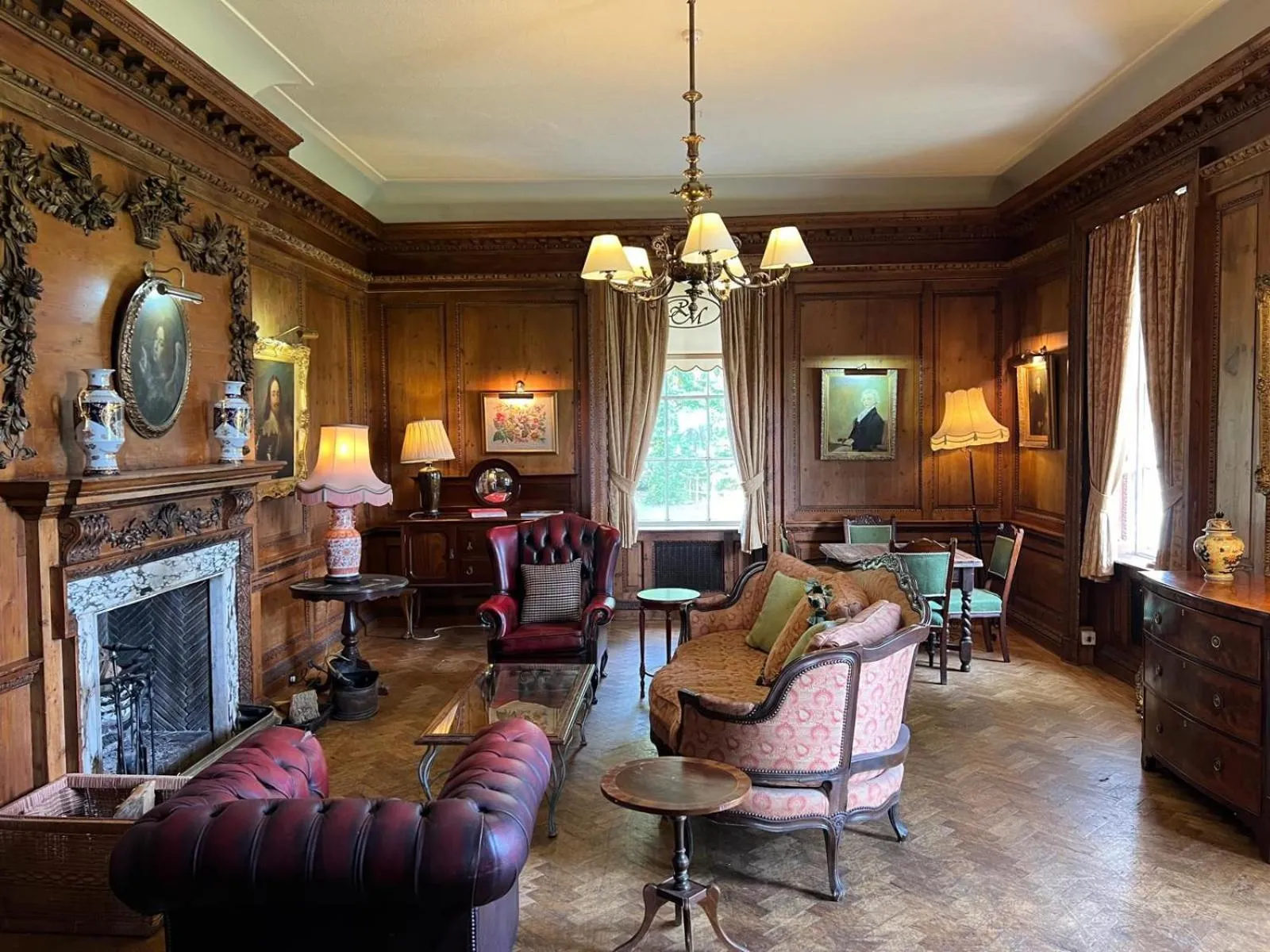 Communal lounge/ TV room in Rowley Manor hotel
