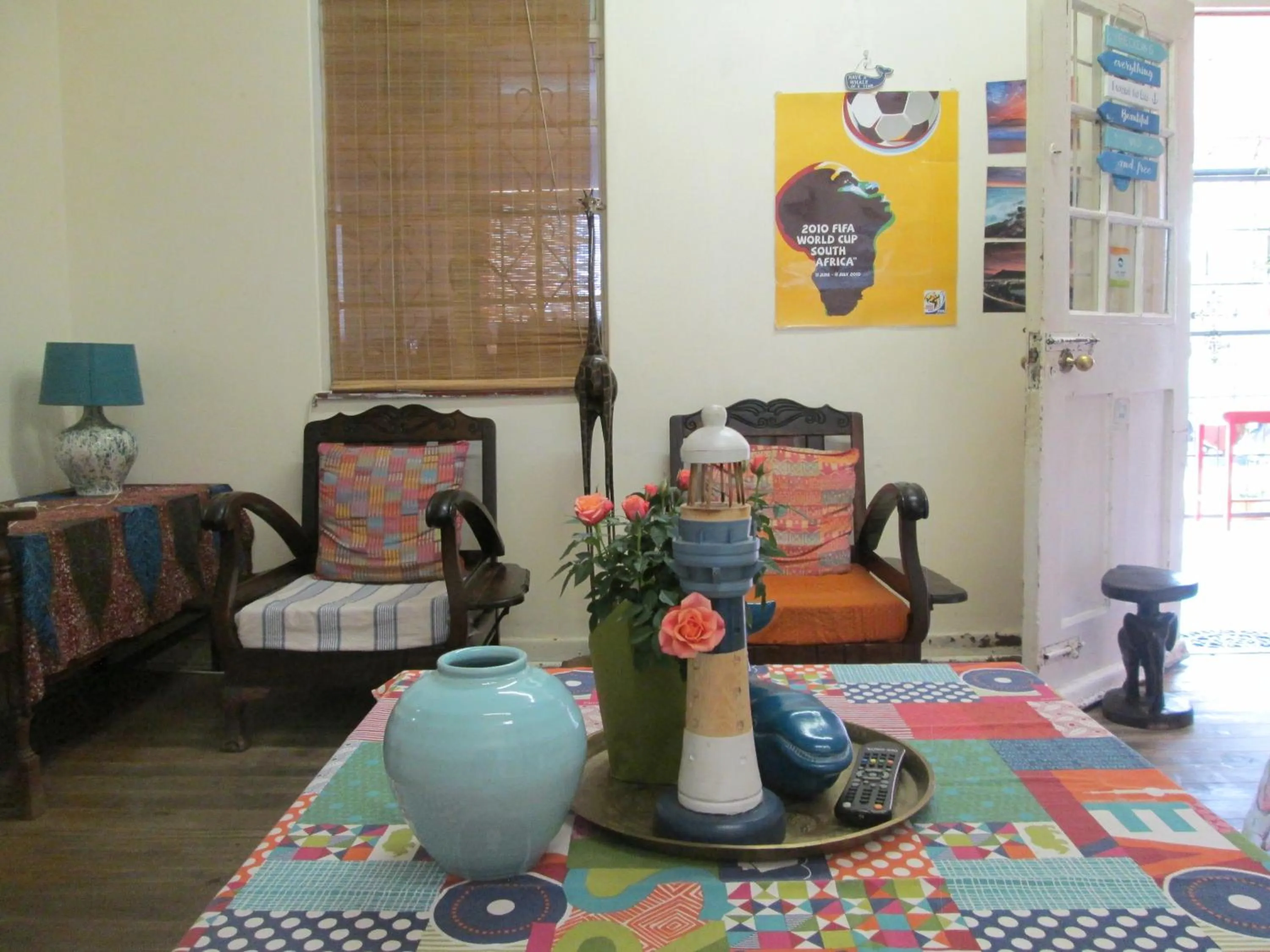 Communal lounge/ TV room in Lighthouse Farm Backpackers Lodge