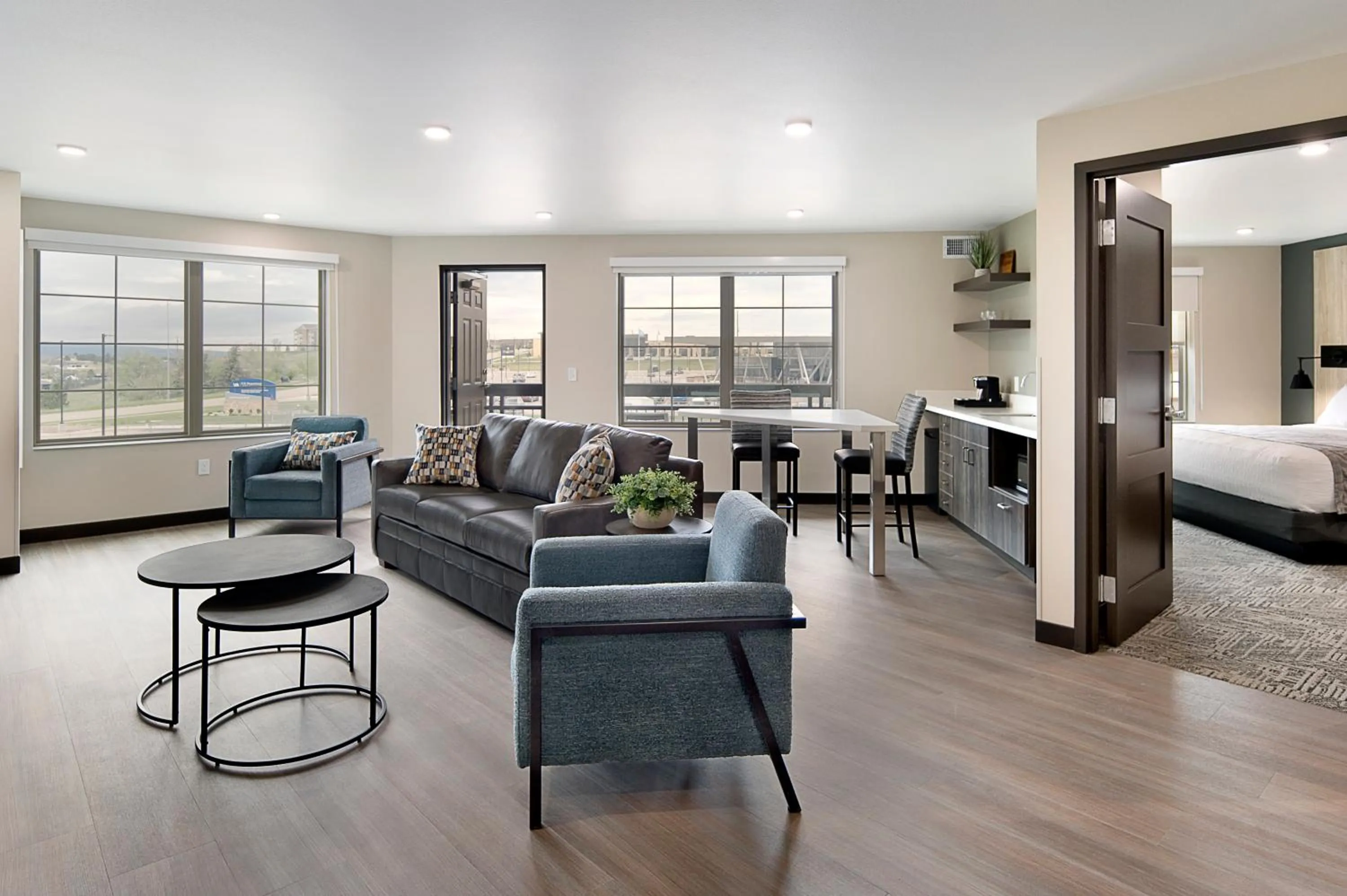 Living room, Bed in ClubHouse Hotel & Suites Rapid City