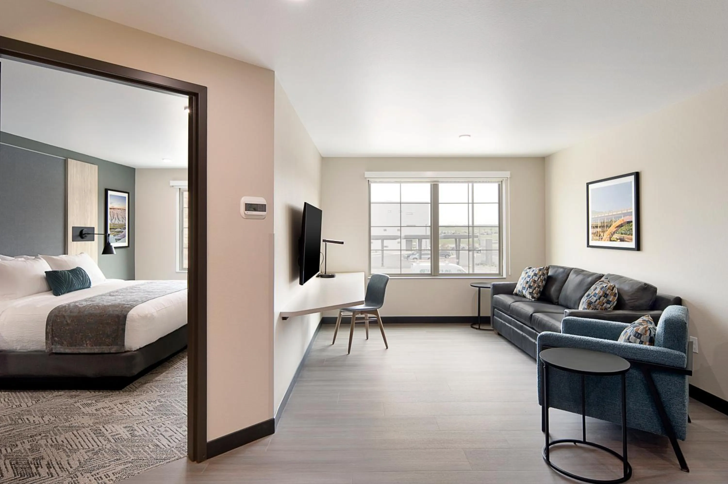 Living room, Bed in ClubHouse Hotel & Suites Rapid City