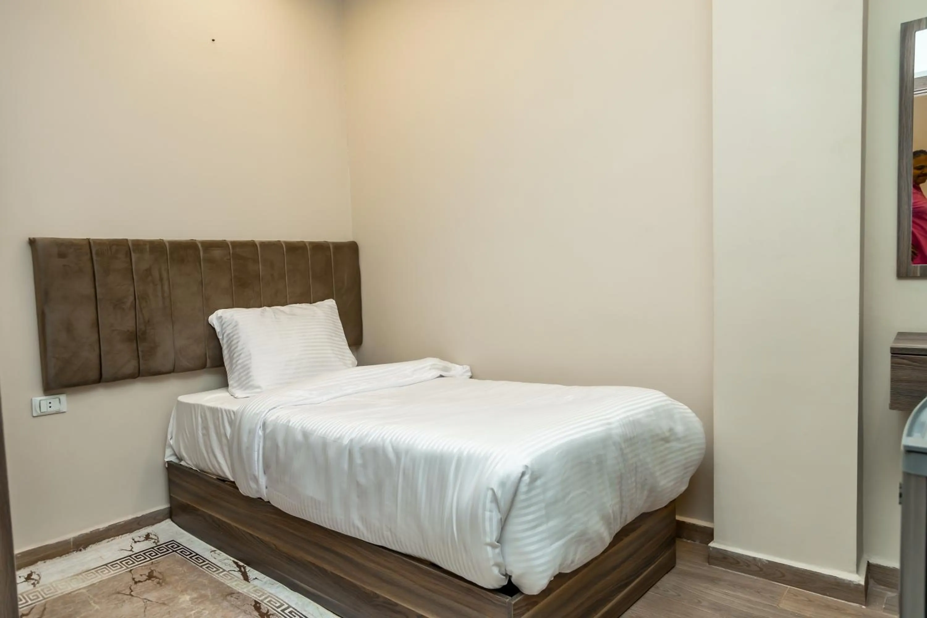 Bed in Night Pyramids Inn Hotel