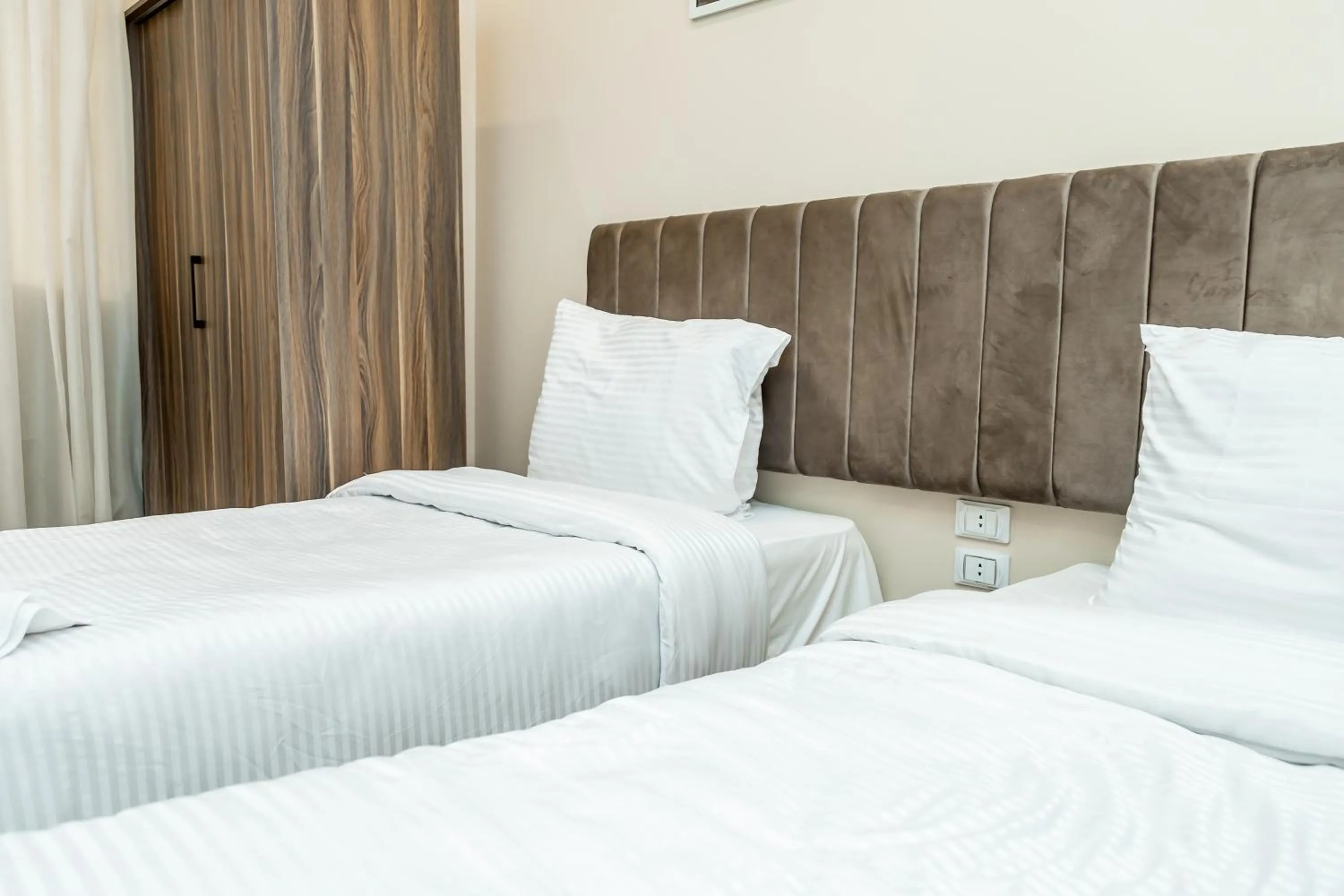 Bed in Night Pyramids Inn Hotel