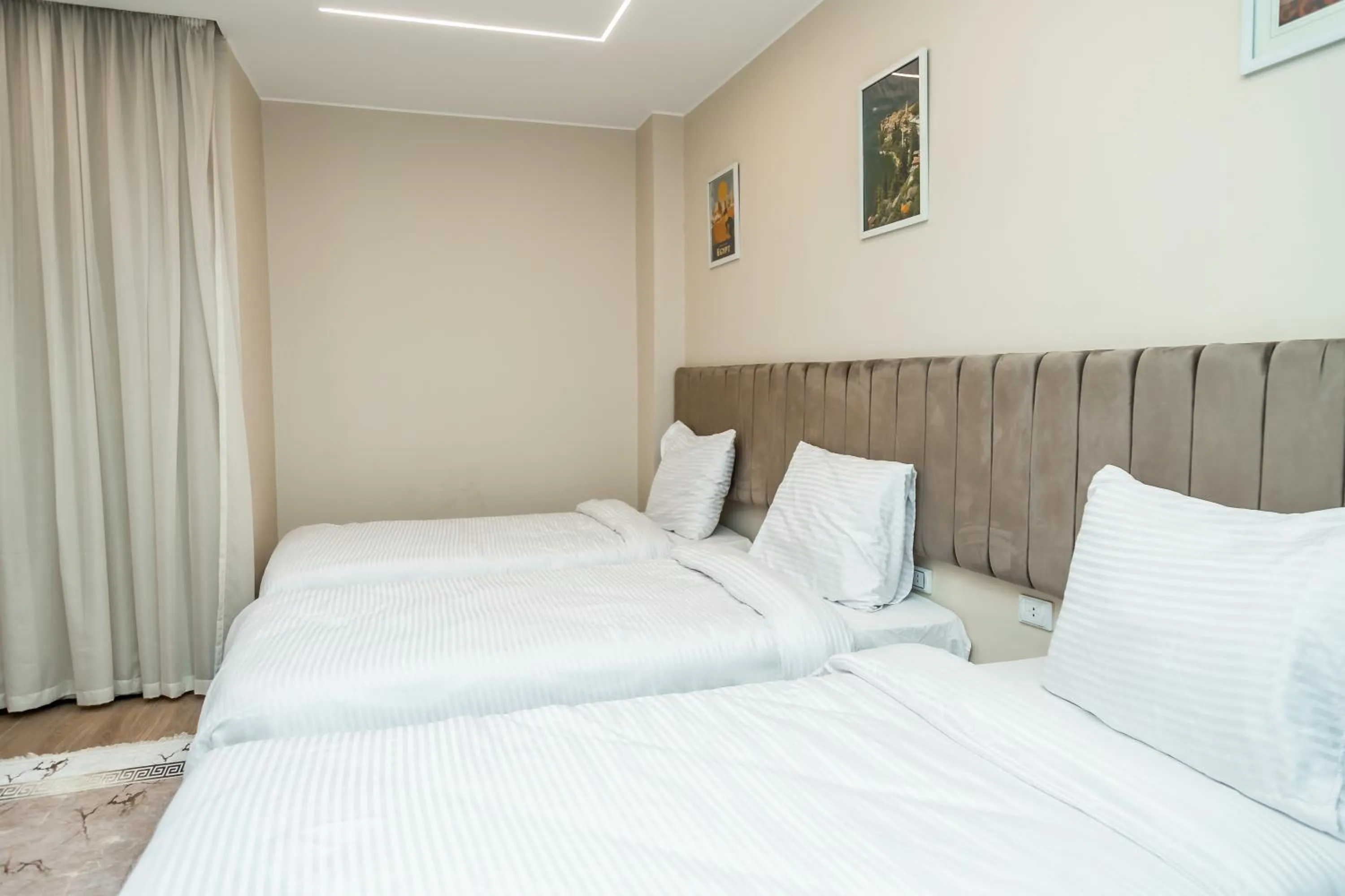 Bed in Night Pyramids Inn Hotel