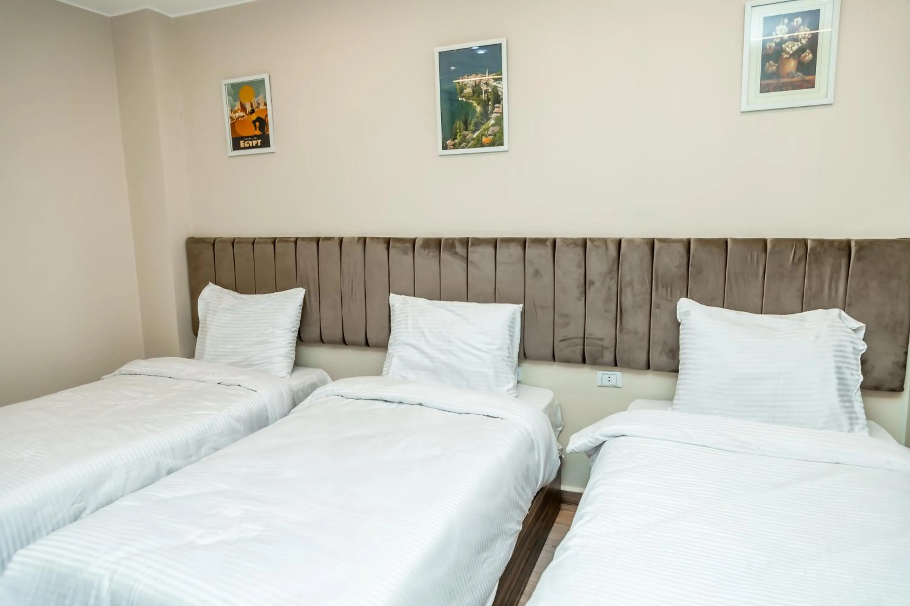 Bed in Night Pyramids Inn Hotel