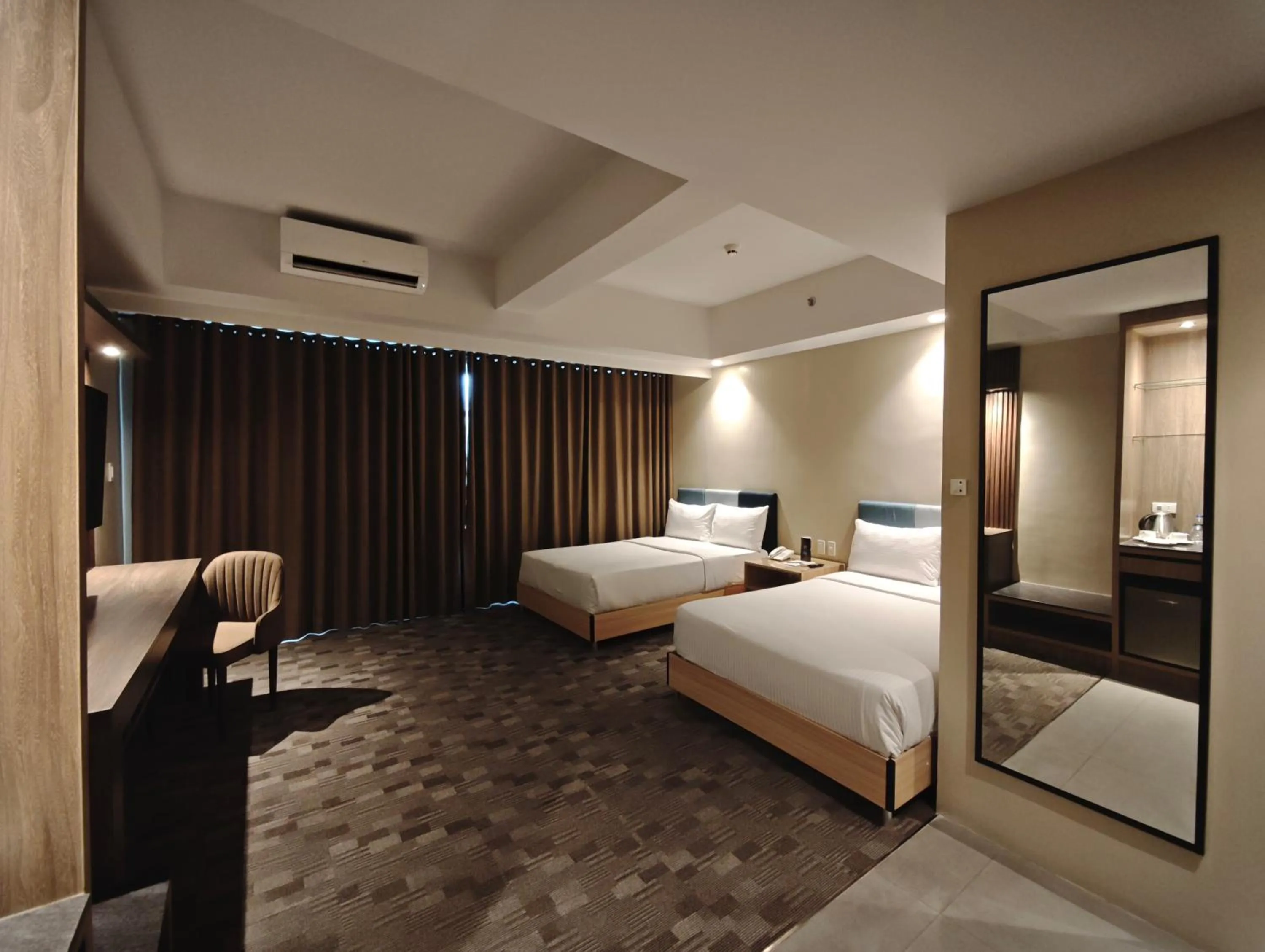 Bed in The Tribute Hotel