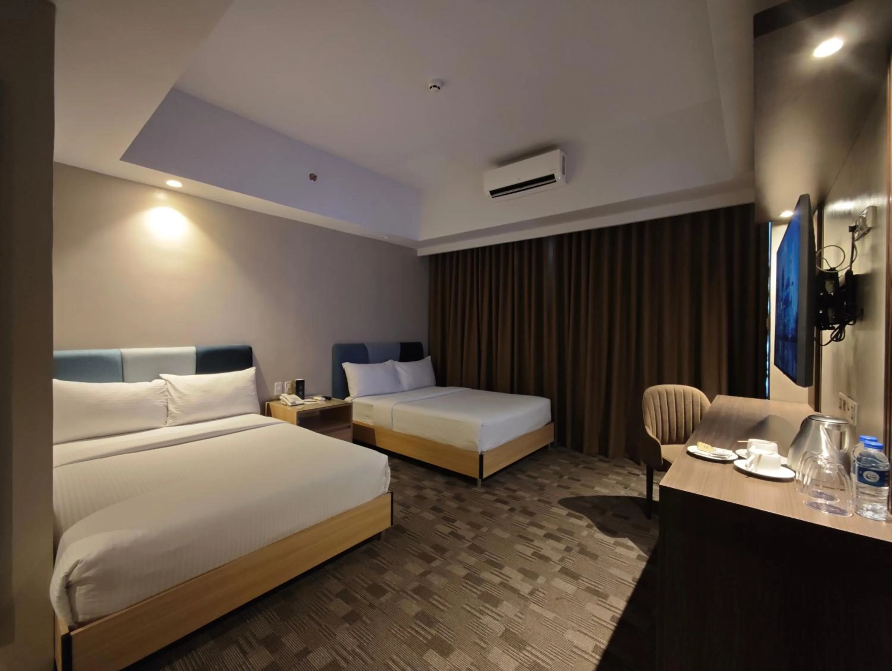 Bed in The Tribute Hotel