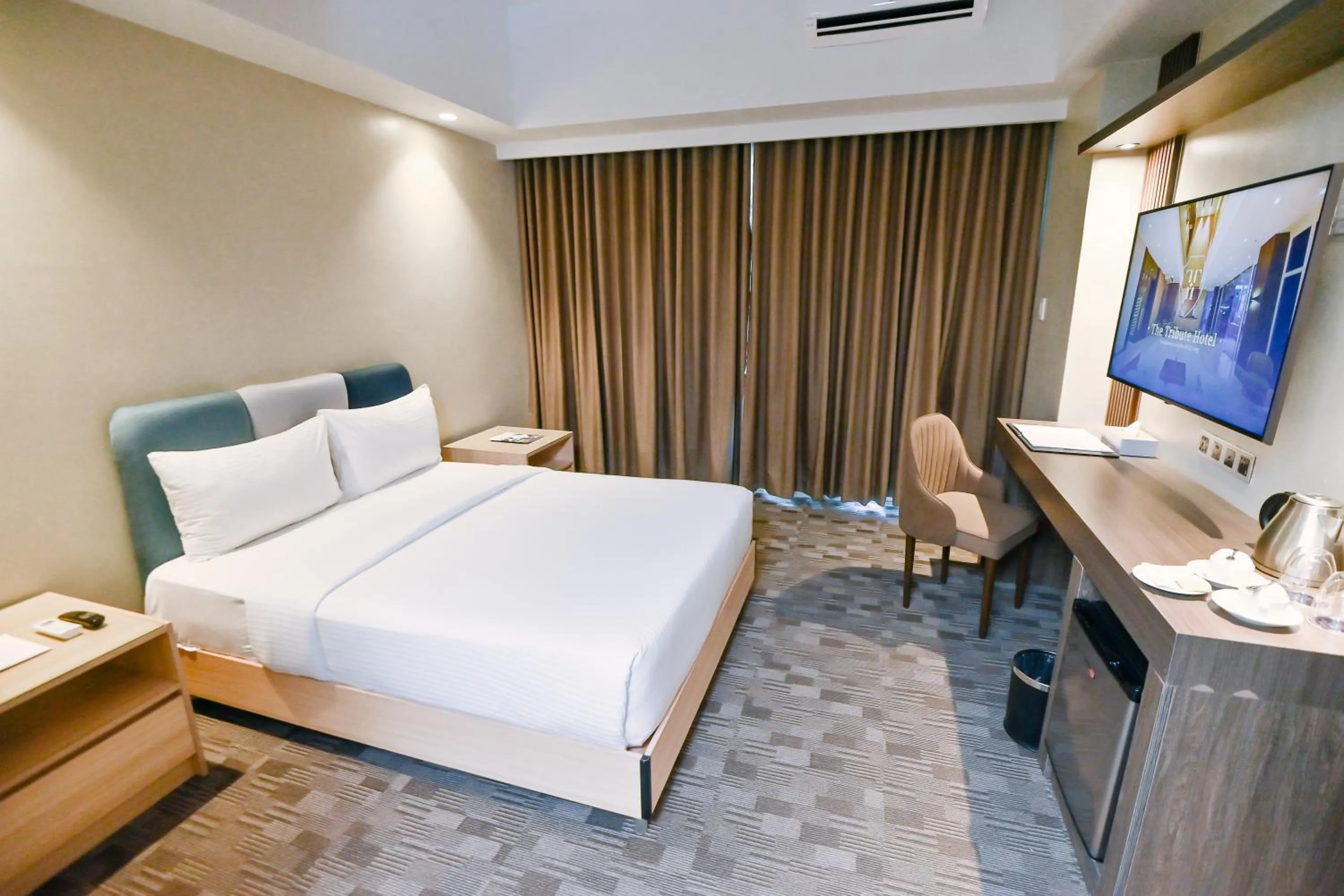 Bed in The Tribute Hotel